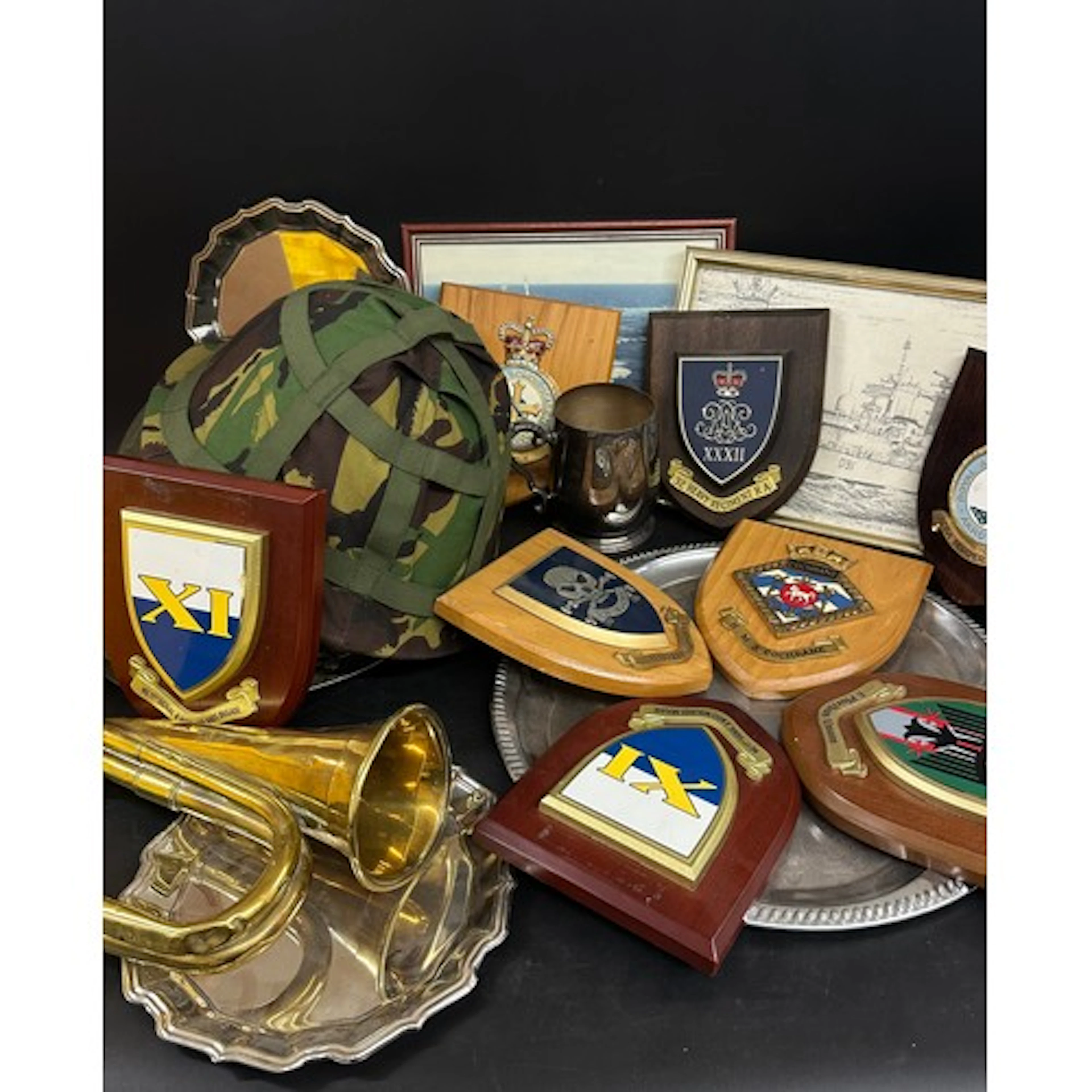 Three British Steel helmets, brass B.B.I.M. Ltd. bugle, coll...