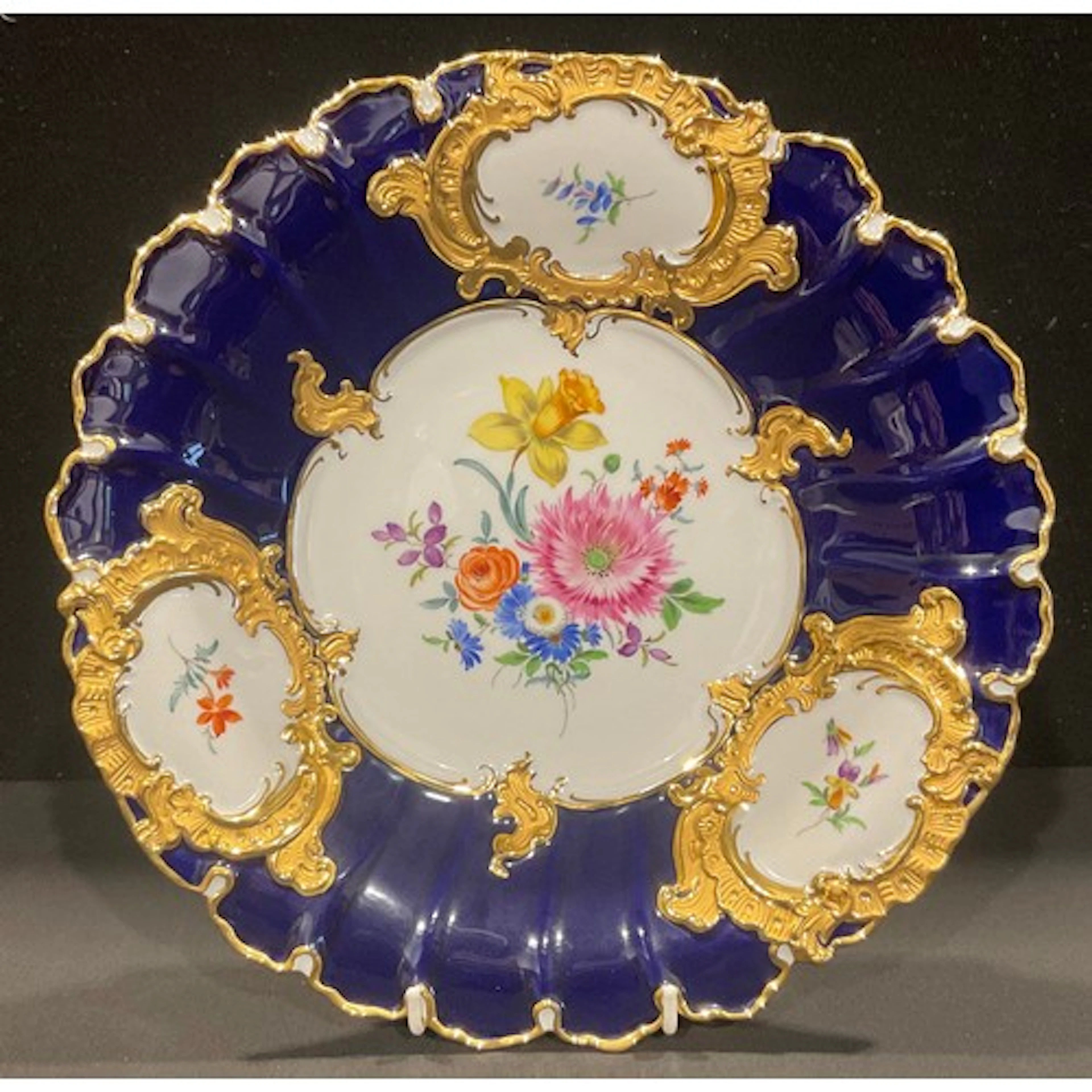 A Meissen shaped circular cabinet plate, decorated with colo...