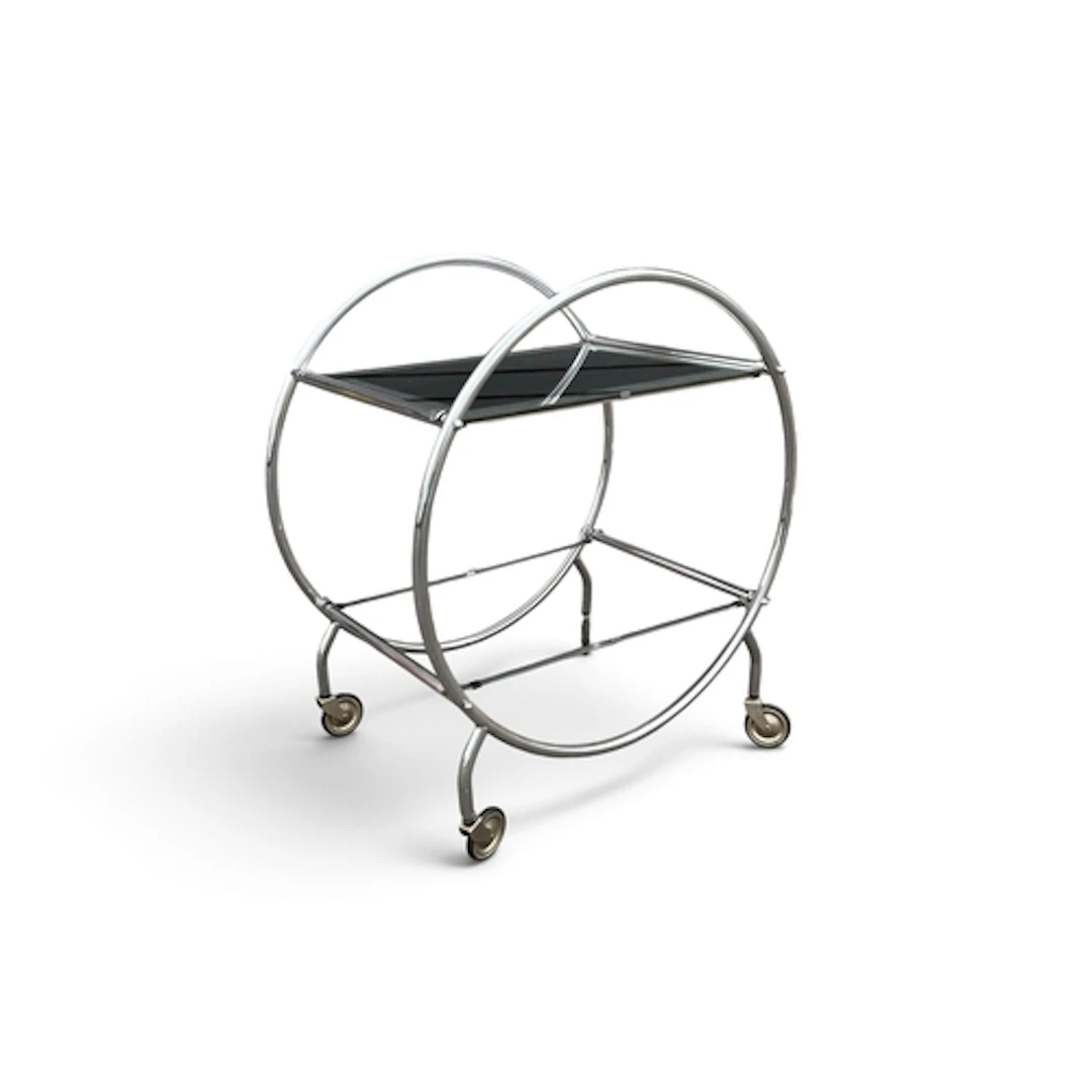 AN ART DECO CHROME AND GLASS DRINKS TROLLEY With circular fr...