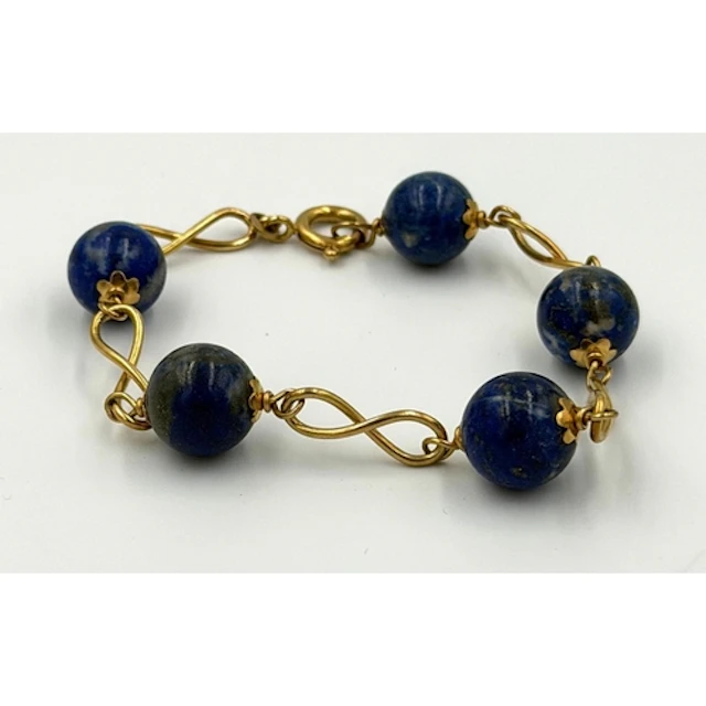 A 14ct yellow gold and lapis lazuli bracelet, approximate le...