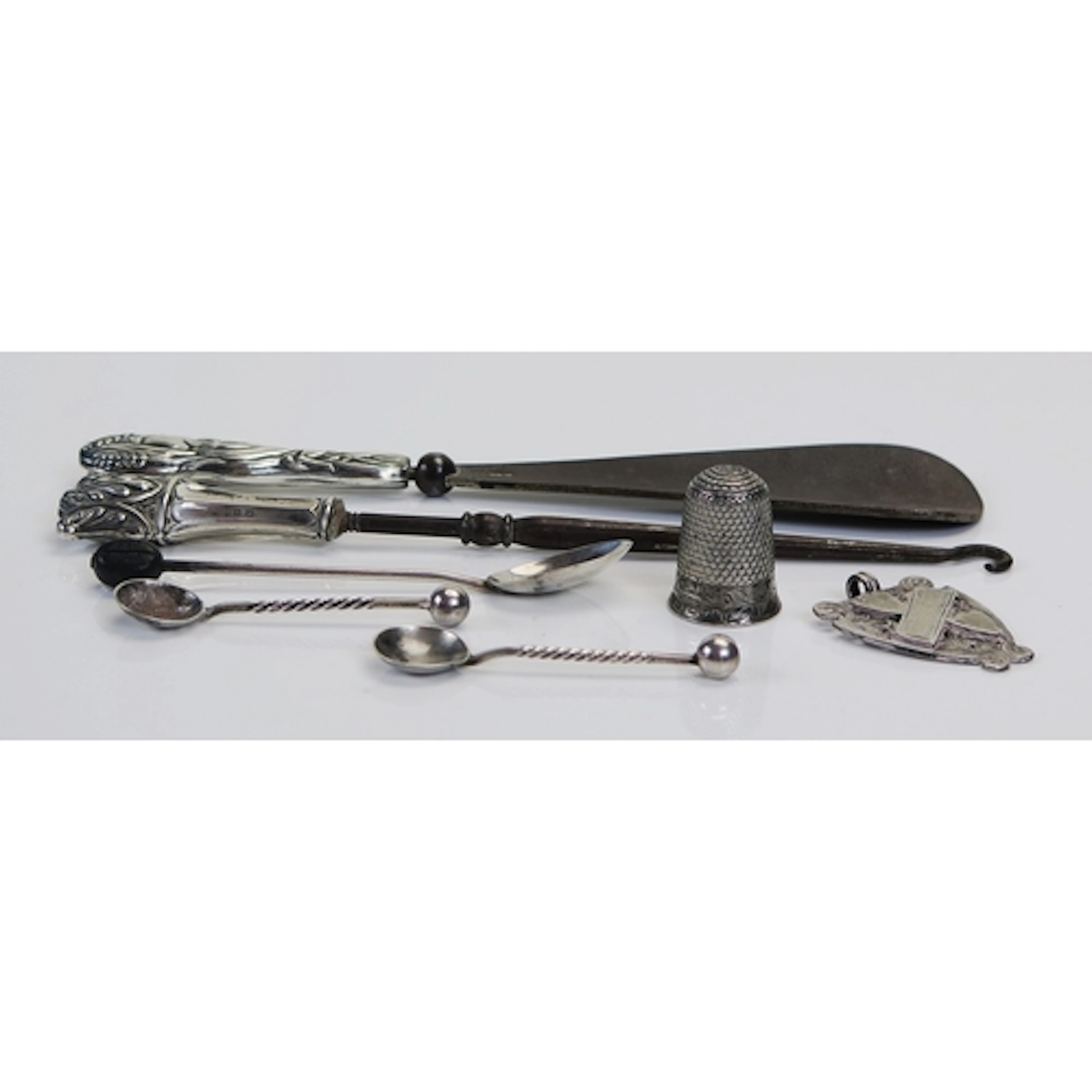 Assorted silverwares to include salt spoons, thimble, fob, c...