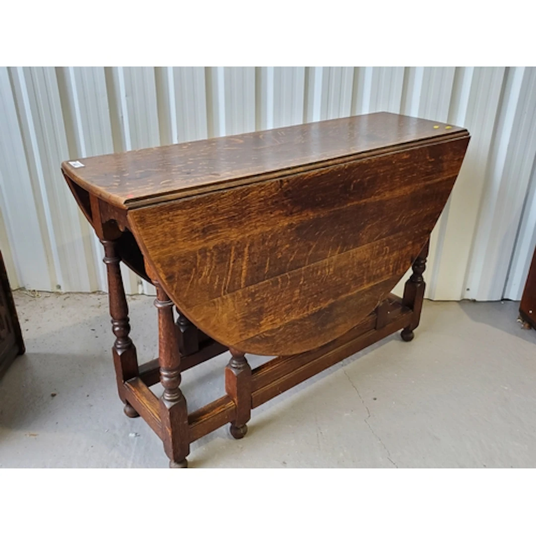 An antique oak Gateleg Table on baluster turned supports 3ft...