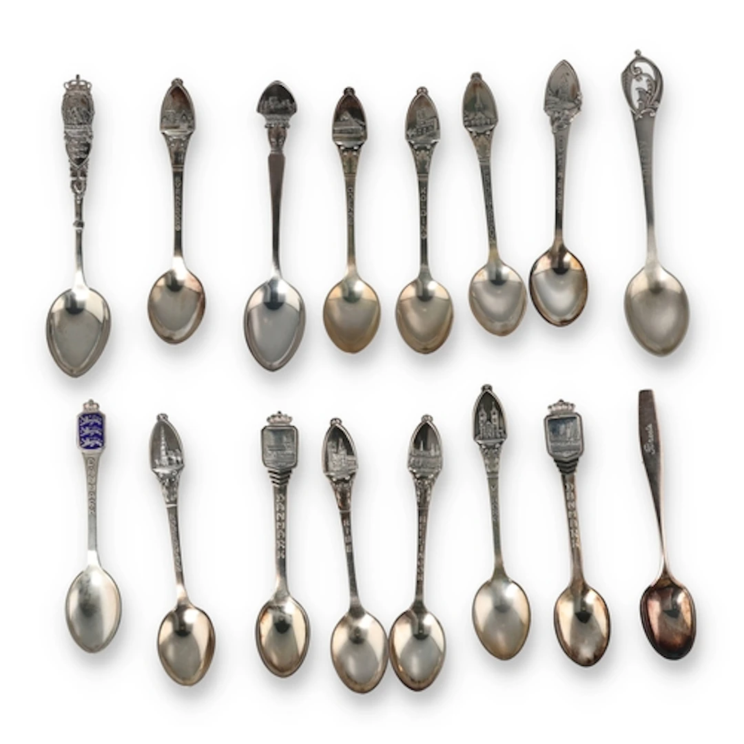 A COLLECTION OF NINE DANISH SILVER SOUVENIR SPOONS, 830S Dep...