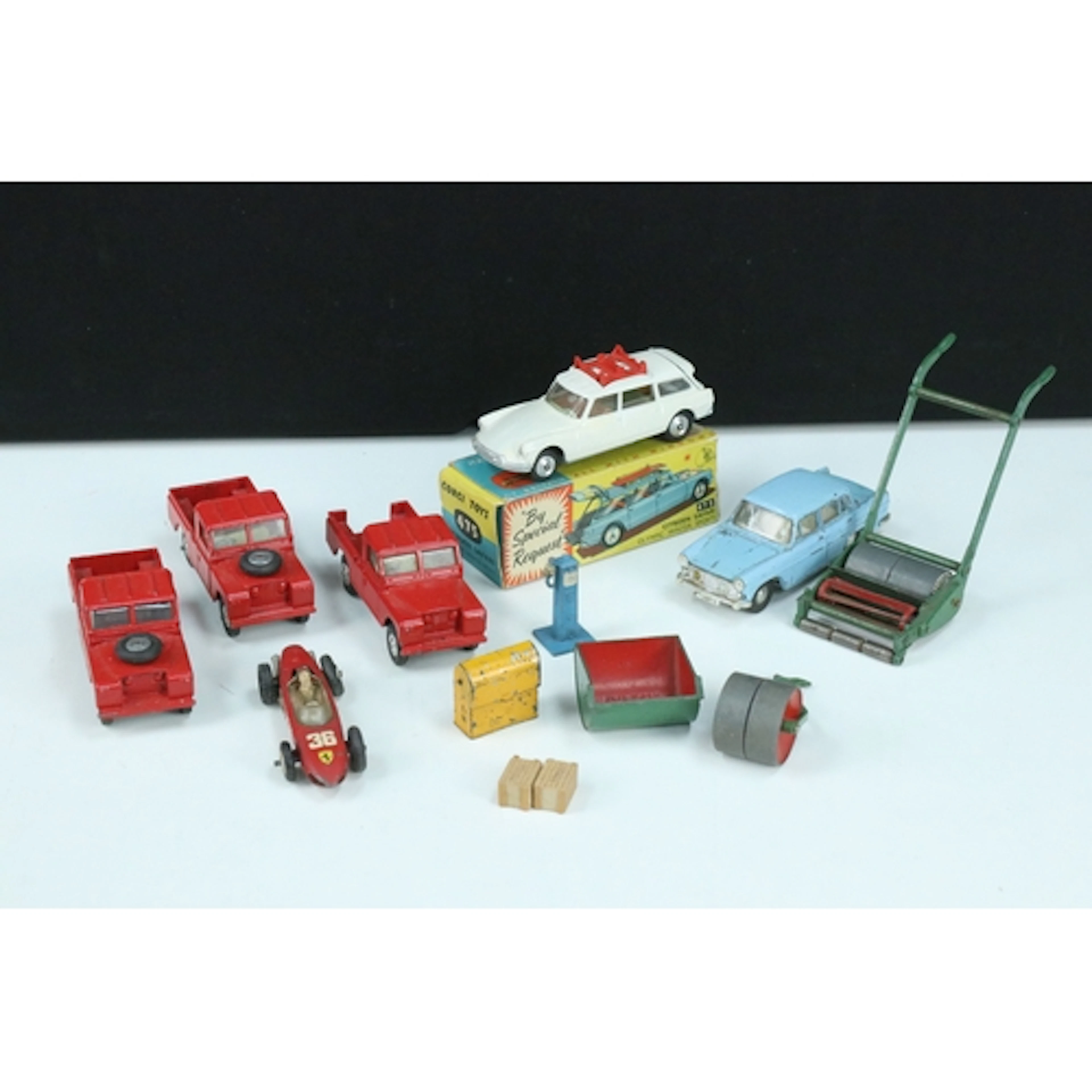 Nine mid 20th C play worn diecast models to include boxed Co...