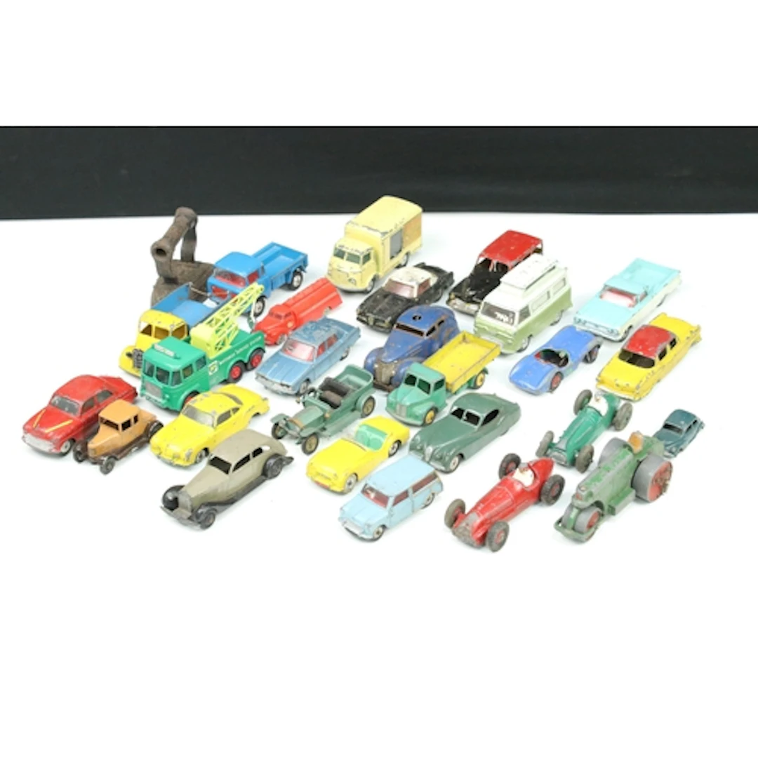 24 Mid 20th C playworn diecast models to include Dinky, Corg...