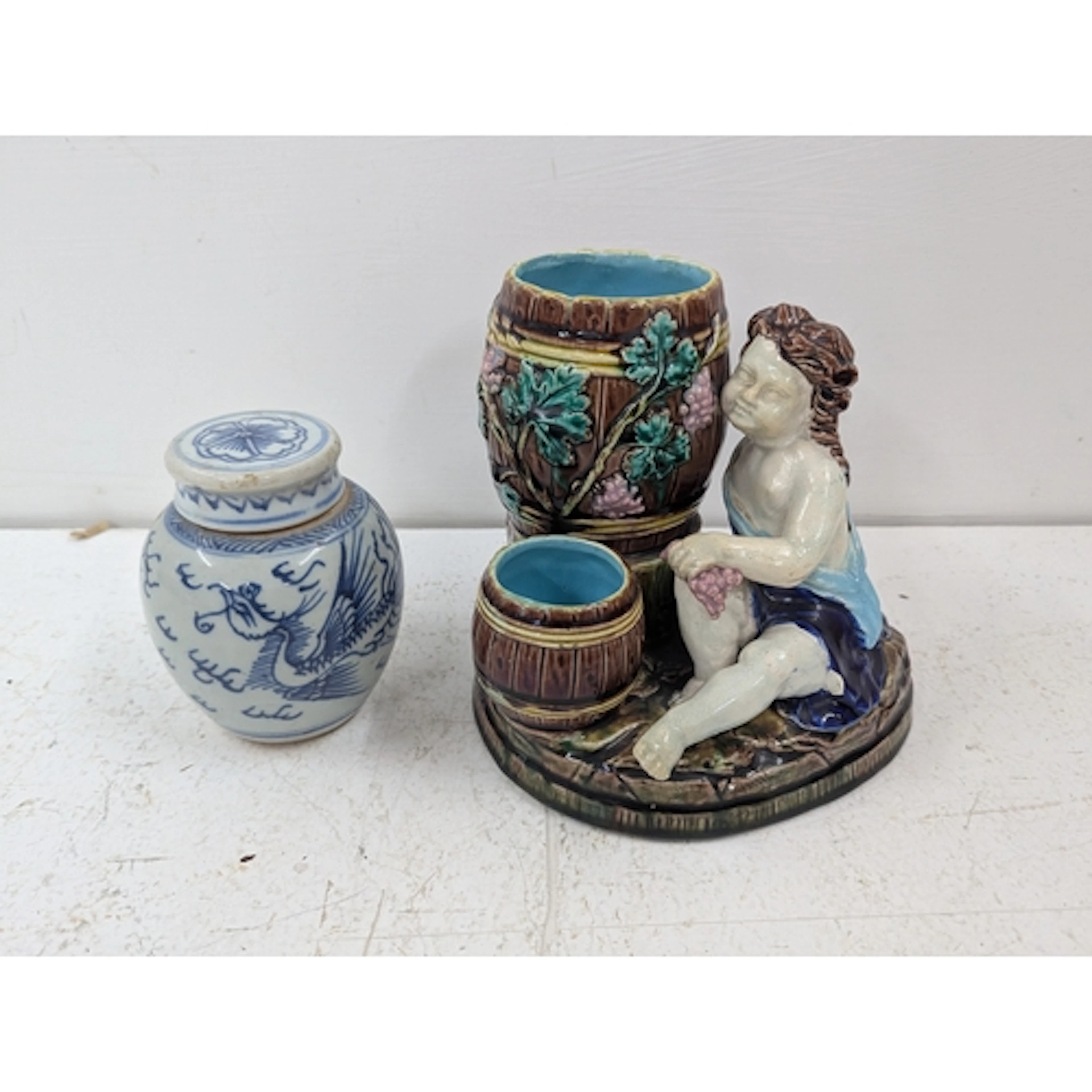 A Majolica figural sweetmeat double barrel cache pot, togeth...