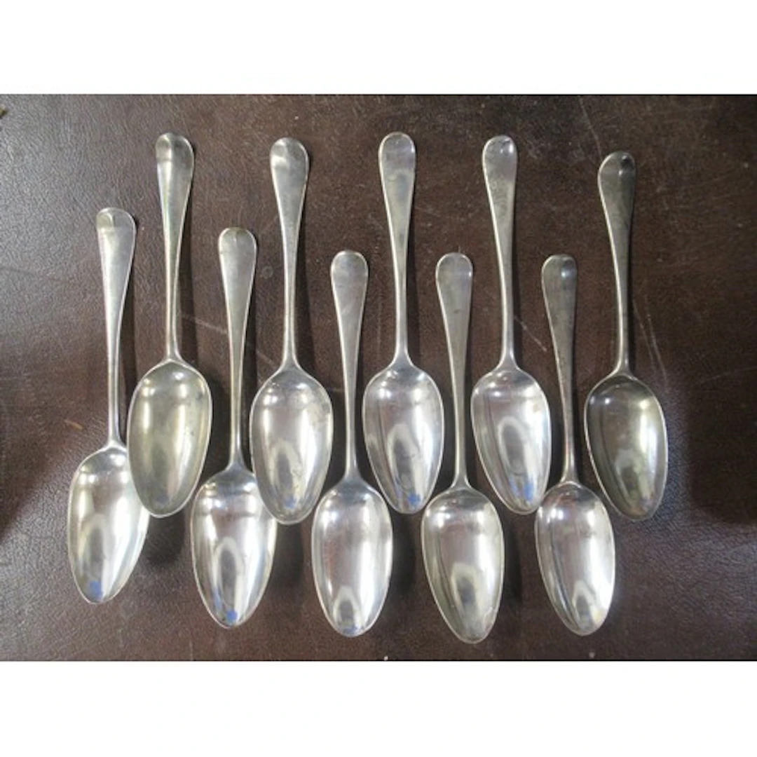 A set of 10 Georgian silver serving spoons, engraved with a ...
