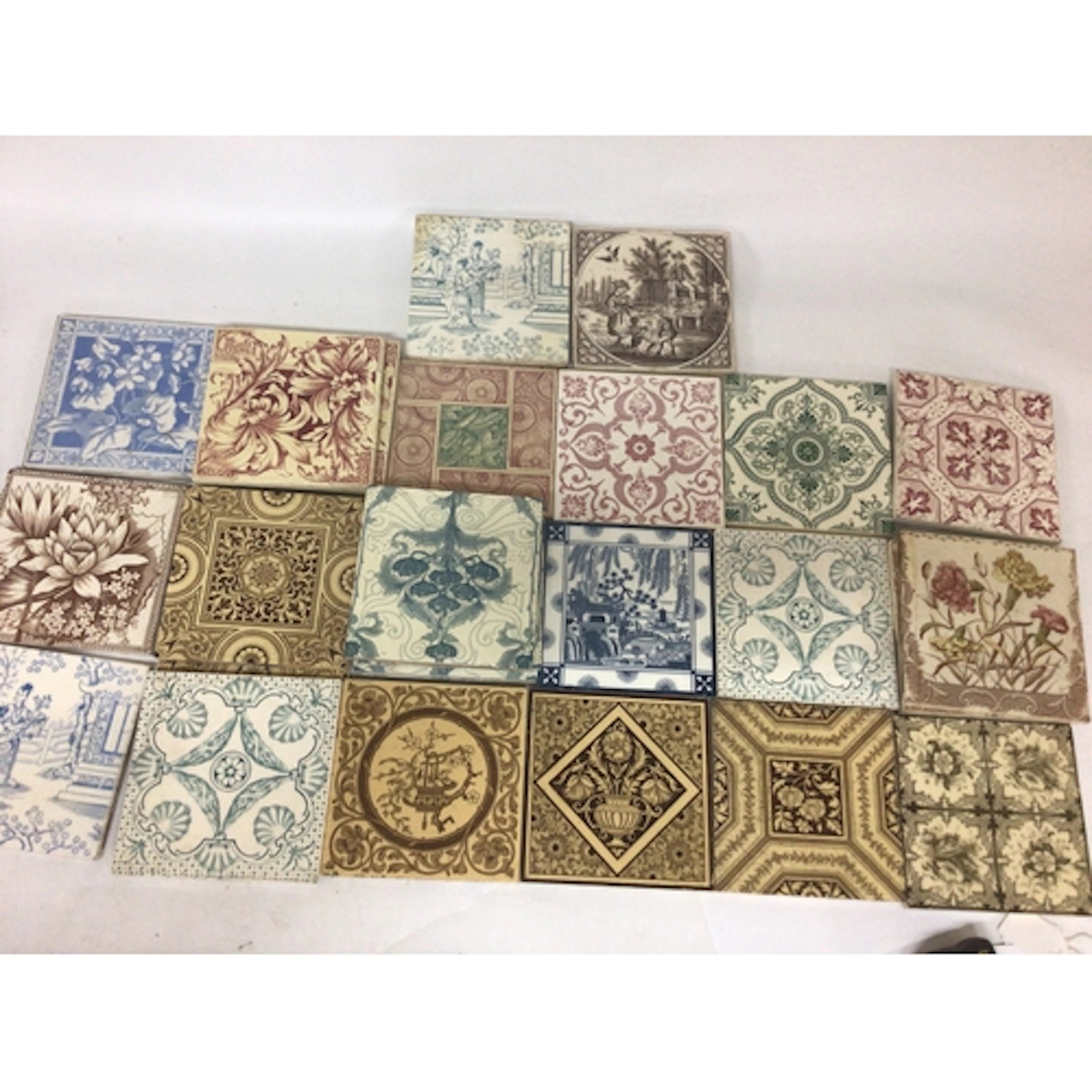 A collection of Victorian patterned tiles including so...