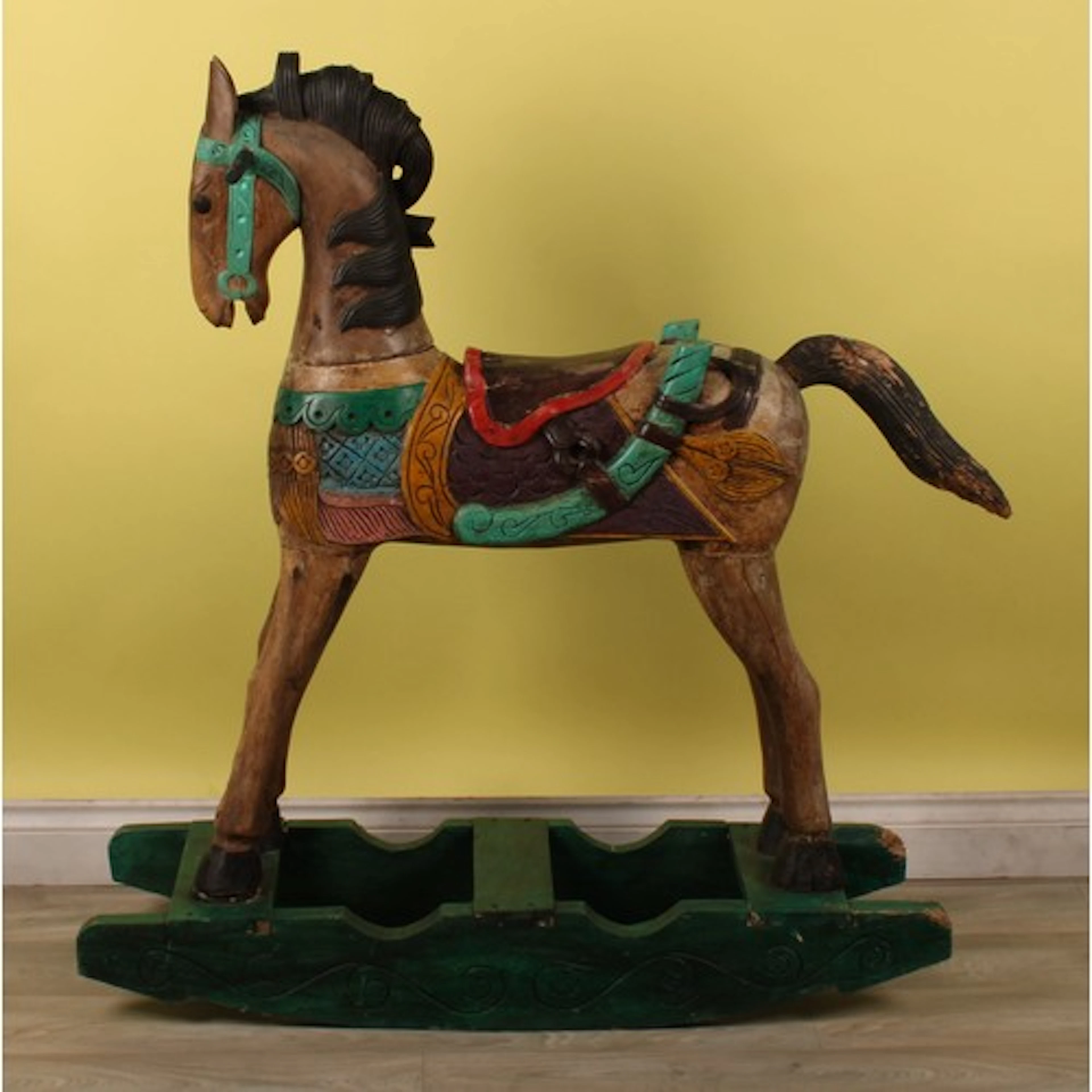 Juvenalia - a carved rocking horse, painted in polychrome, 1...