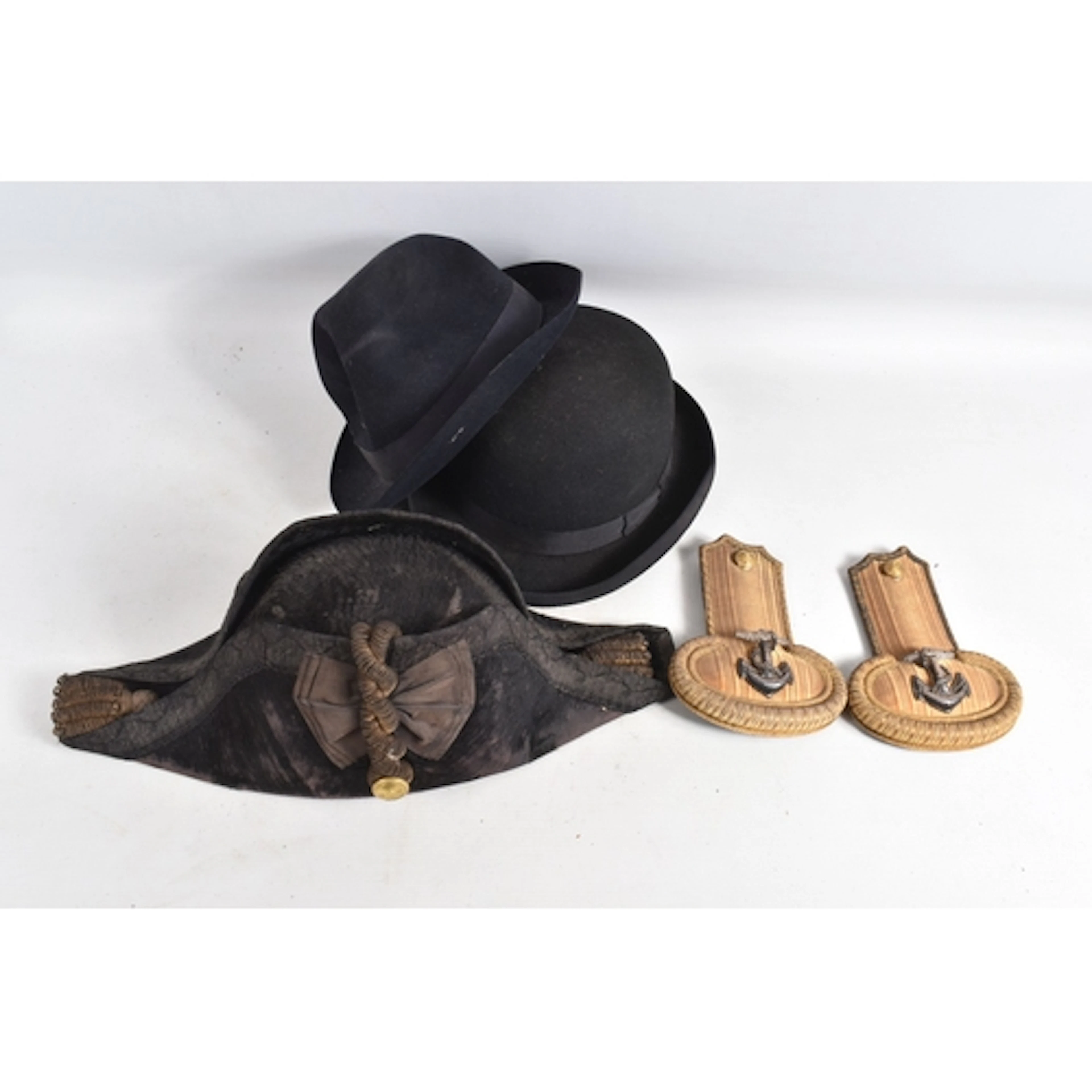 A VINTAGE ROYAL NAVY BICORN HAT AND SHOULDER EPAULETTES MADE...