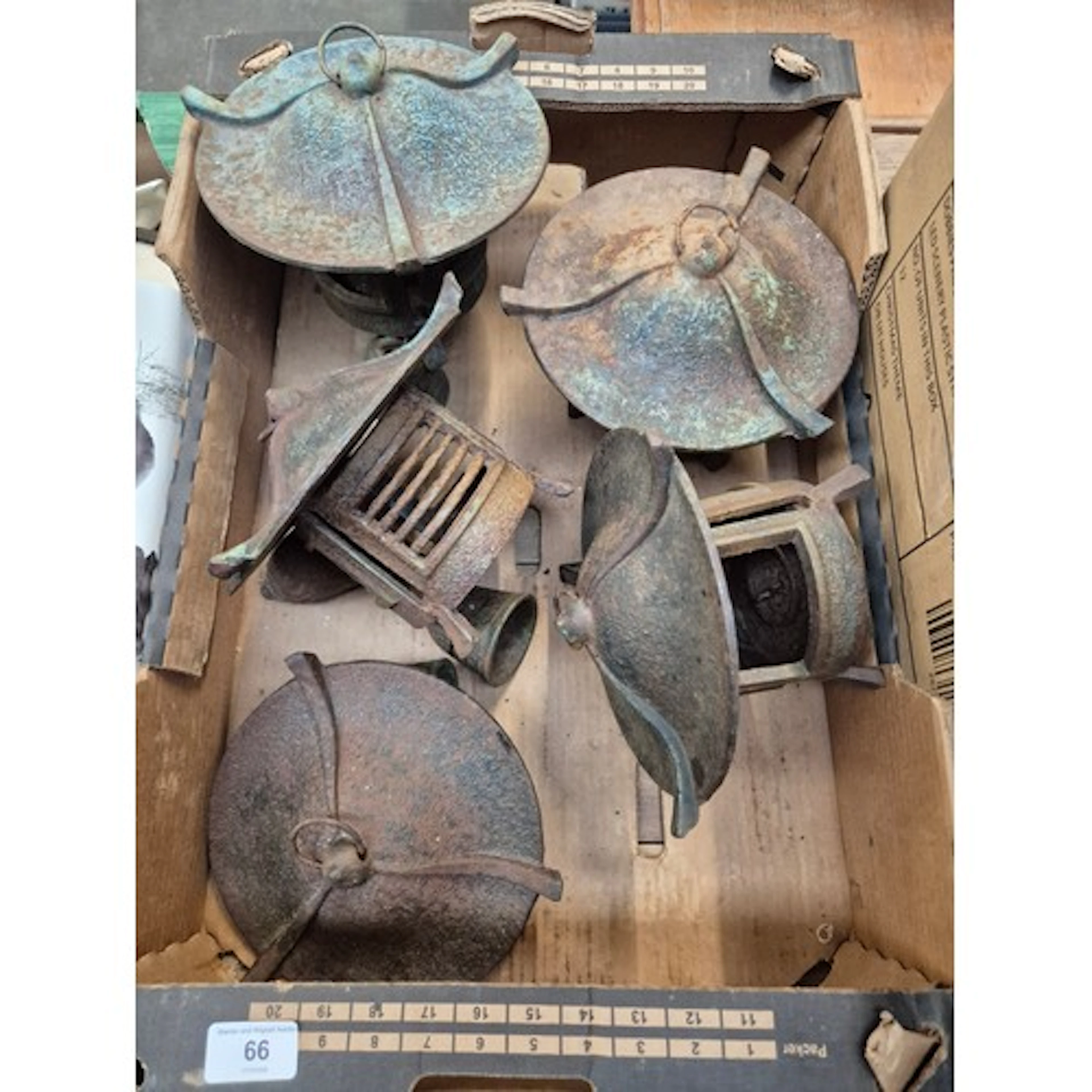 A box of cast metal Japanese pagoda style candle holders/win...