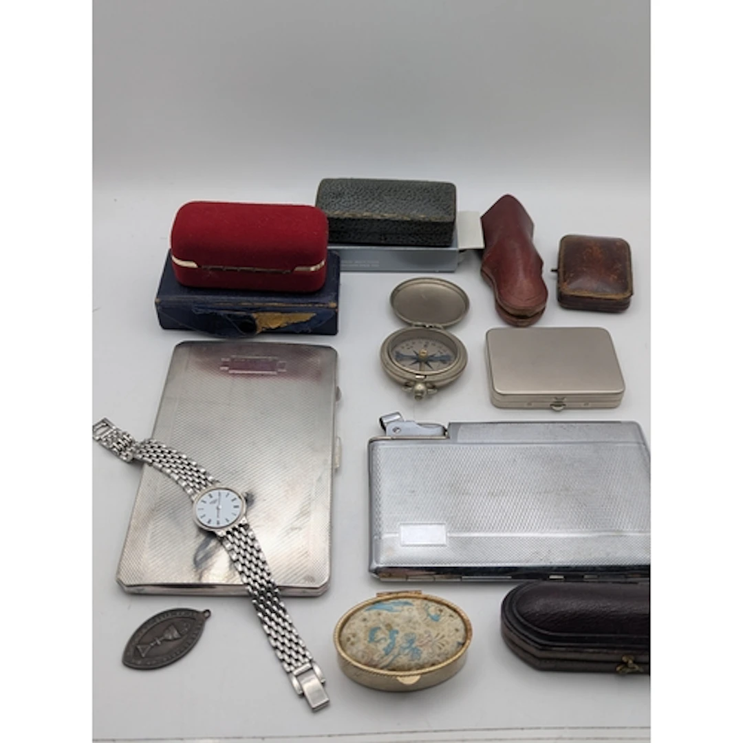A mixed lot to include two cigarette cases, one having a bui...