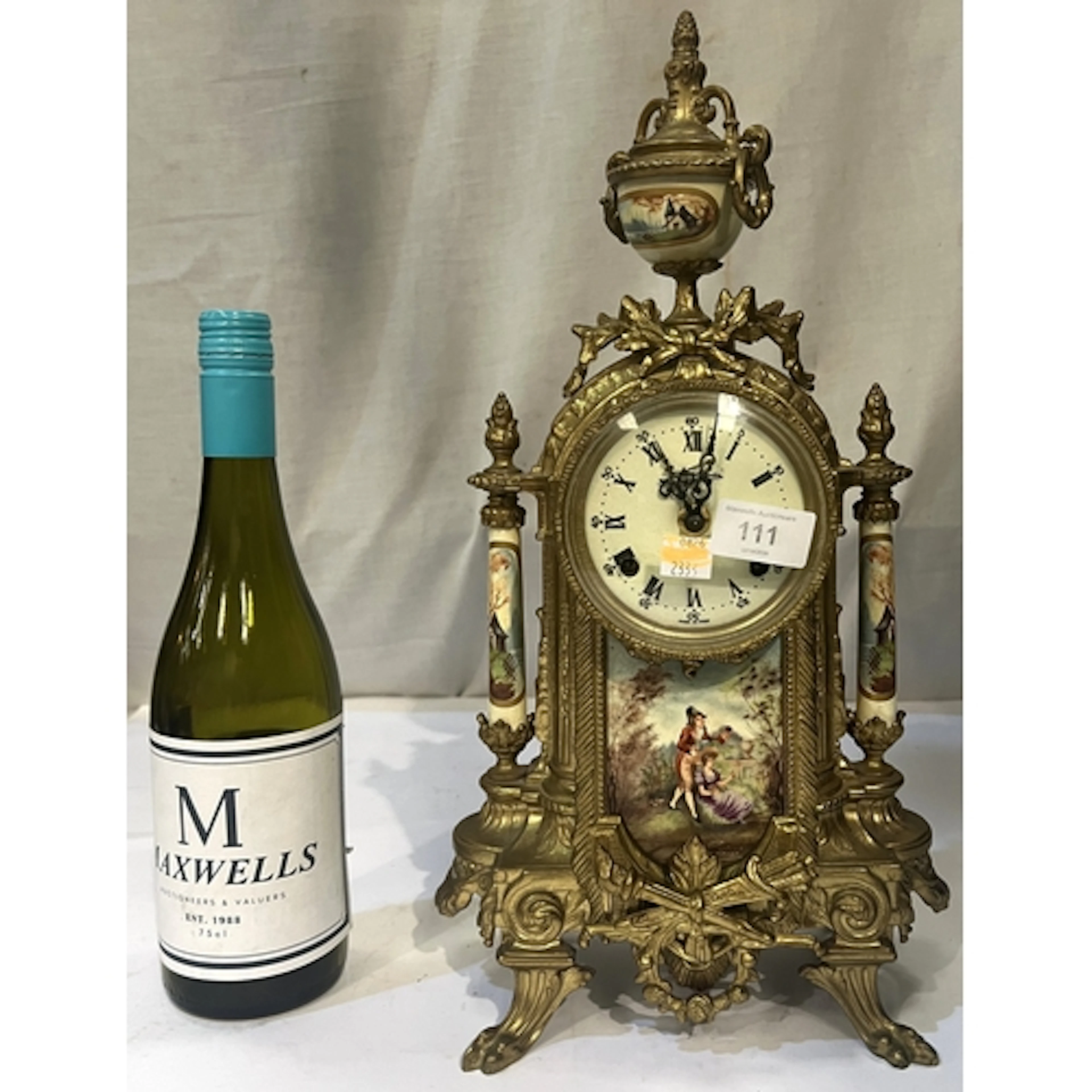 A 20th century Louis XVI style gilt metal and porcelain mant...