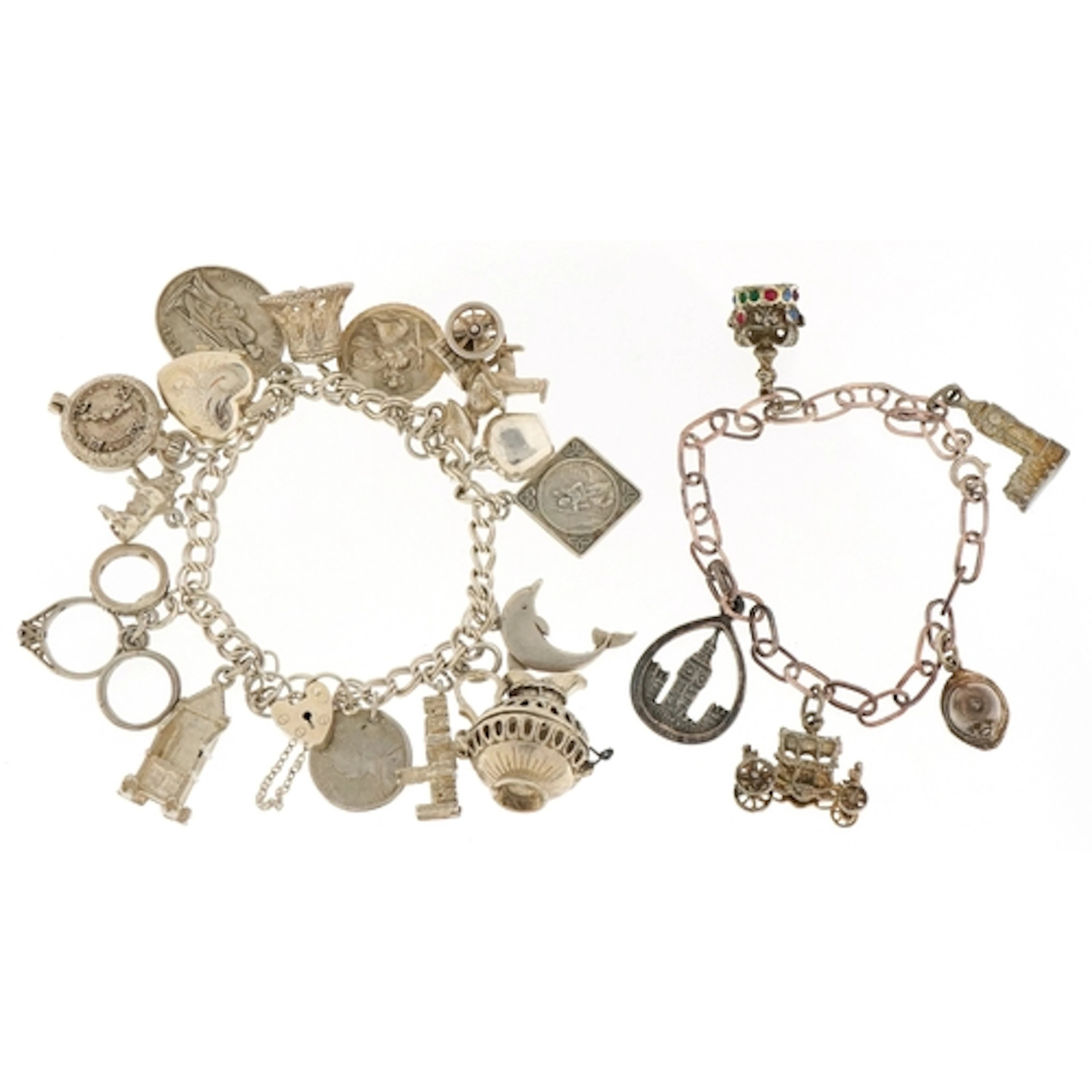 Two silver charm bracelets with predominantly silver charms ...