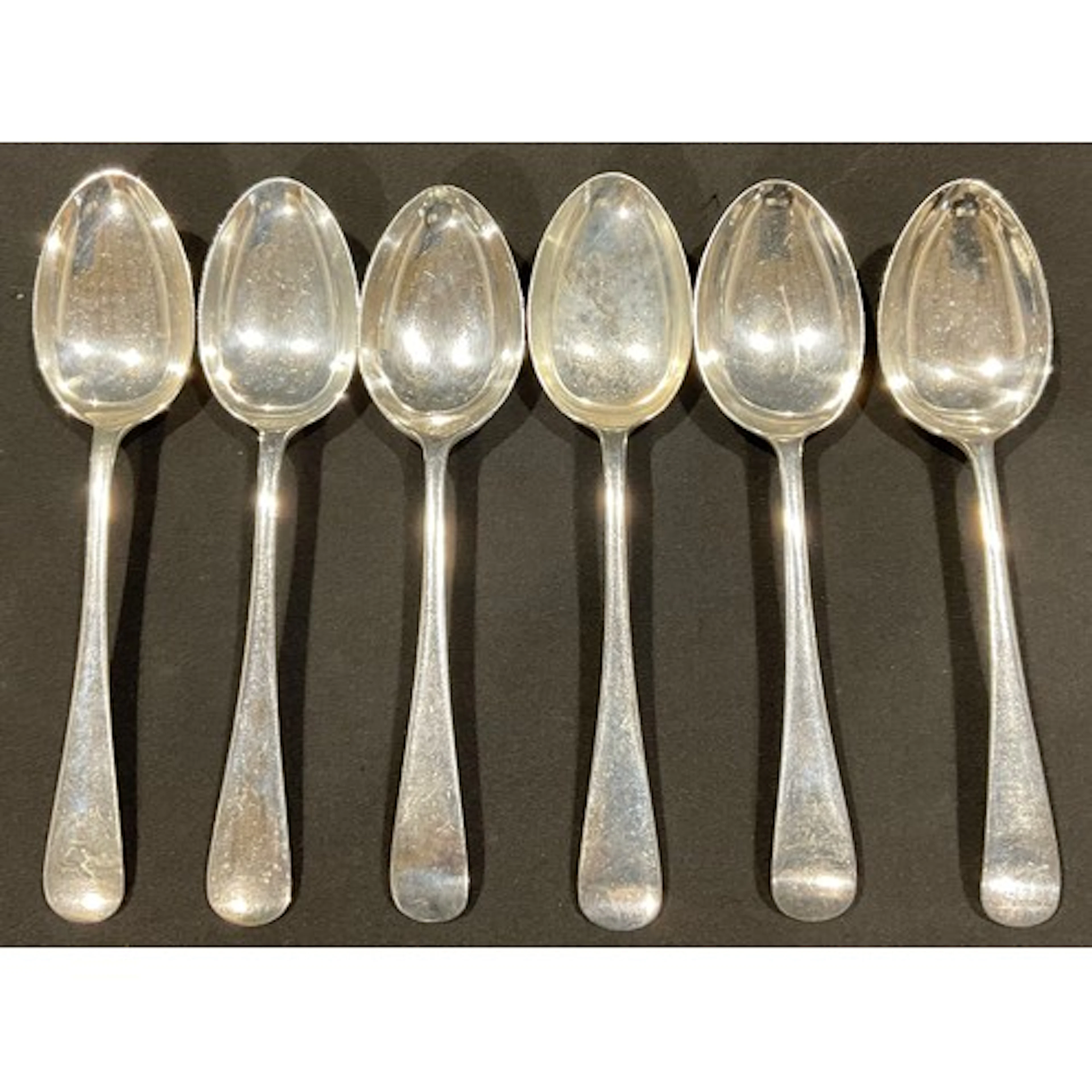 A set of three George V silver dessert spoons, Birmingham 19...