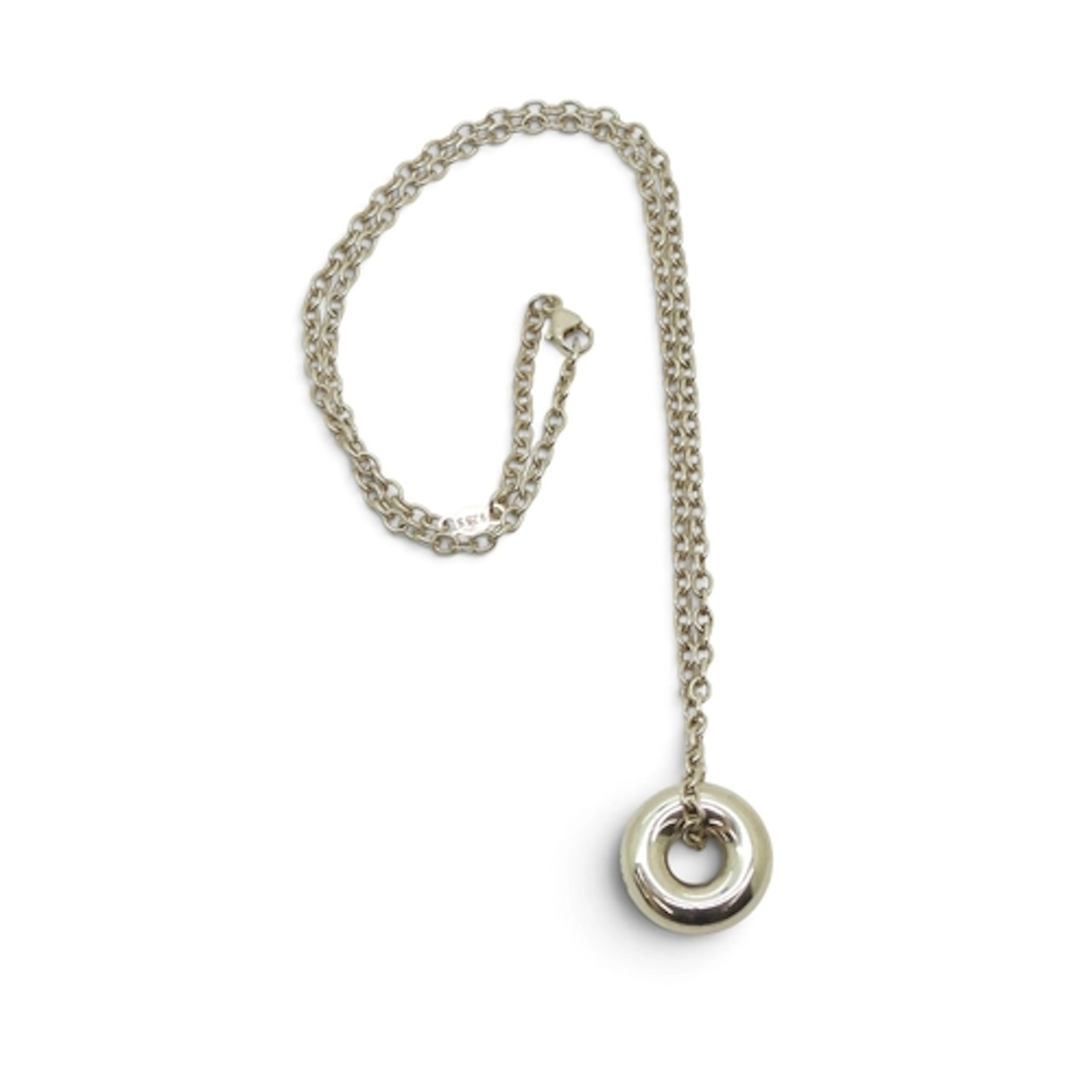 A GEORG JENSEN SILVER PENDANT of doughnut shape stamped with...