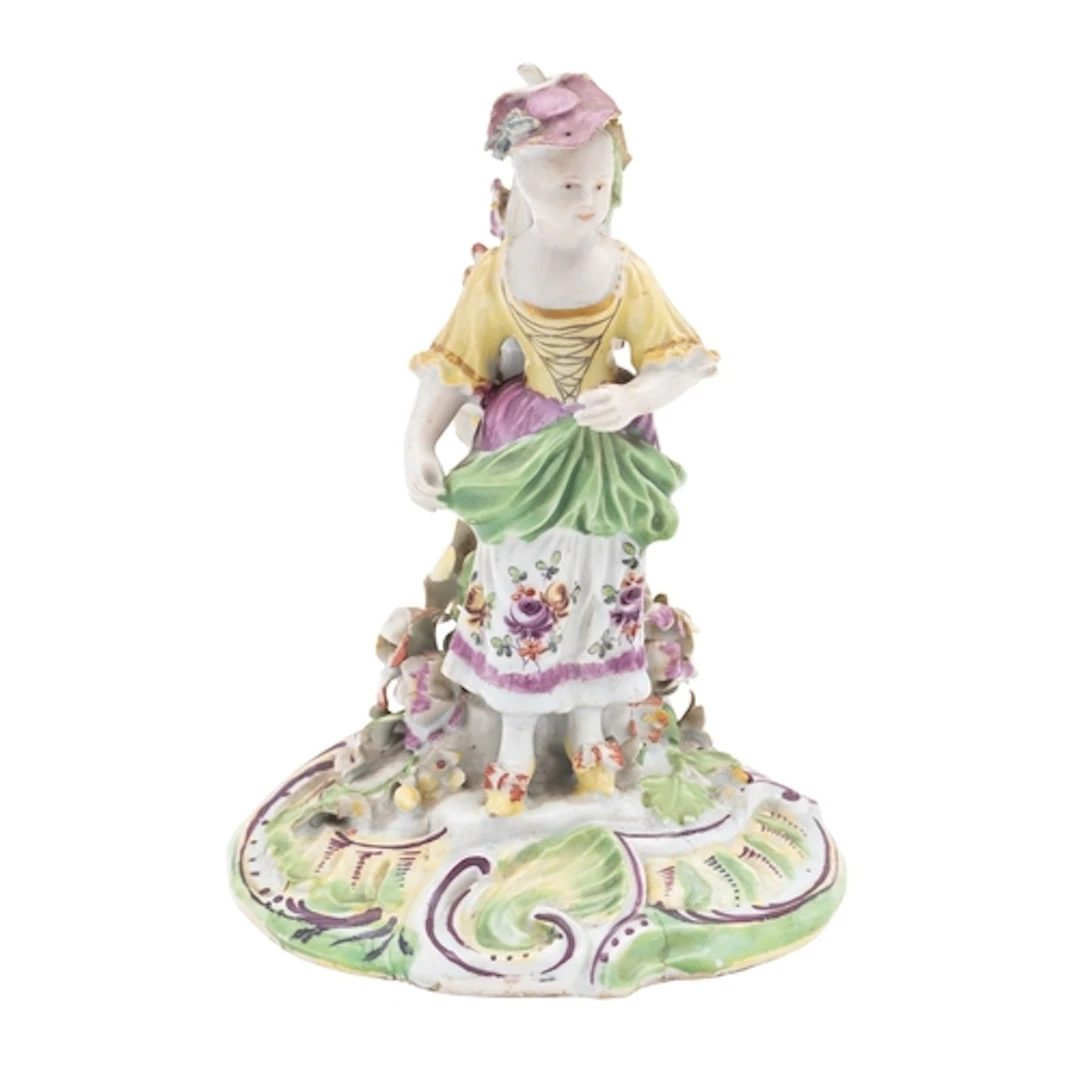 An early Derby [Pale Family] figure of the Farmer's Wife, ci...