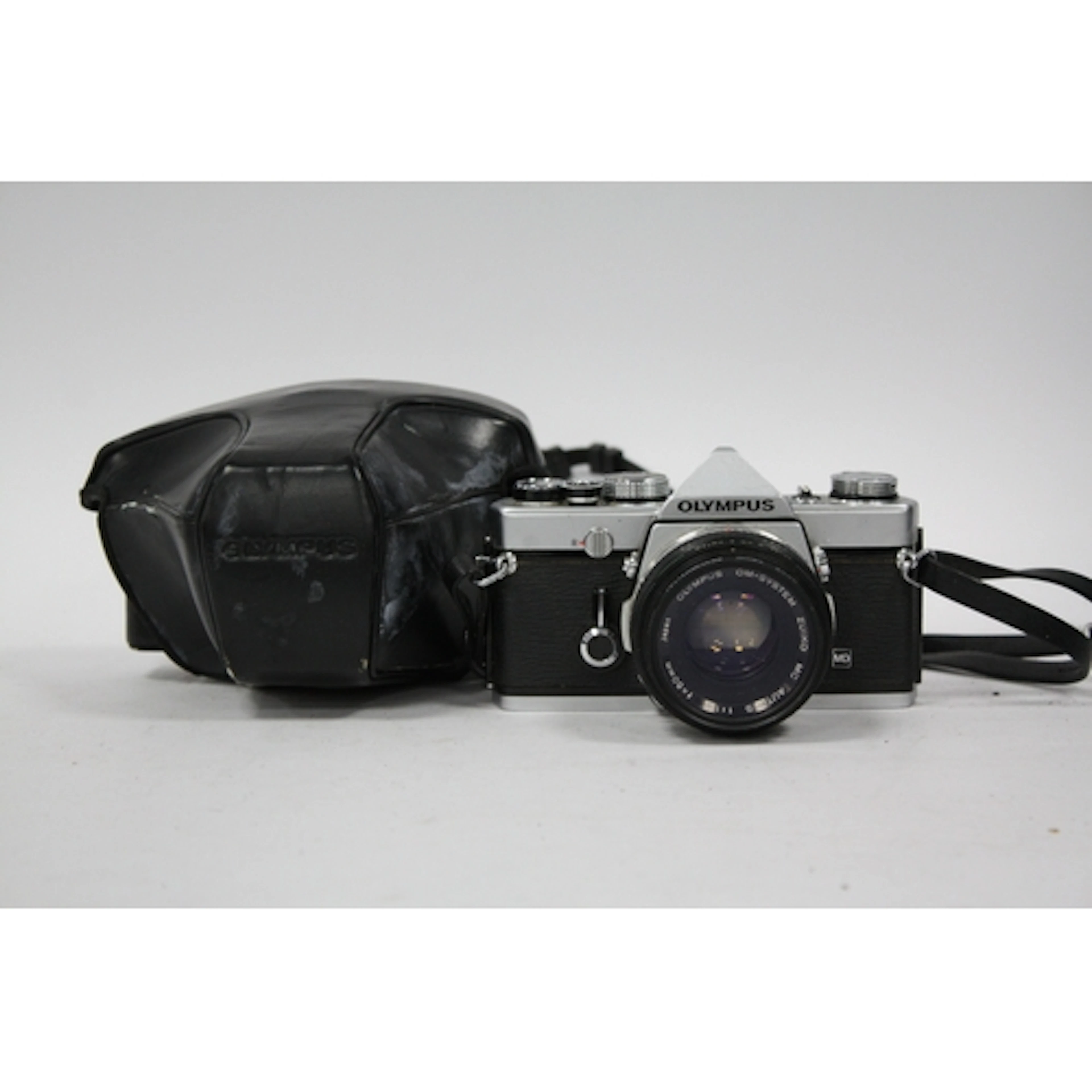 Olympus OM-1 MD 35mm SLR Film Camera with attached Olympus M...