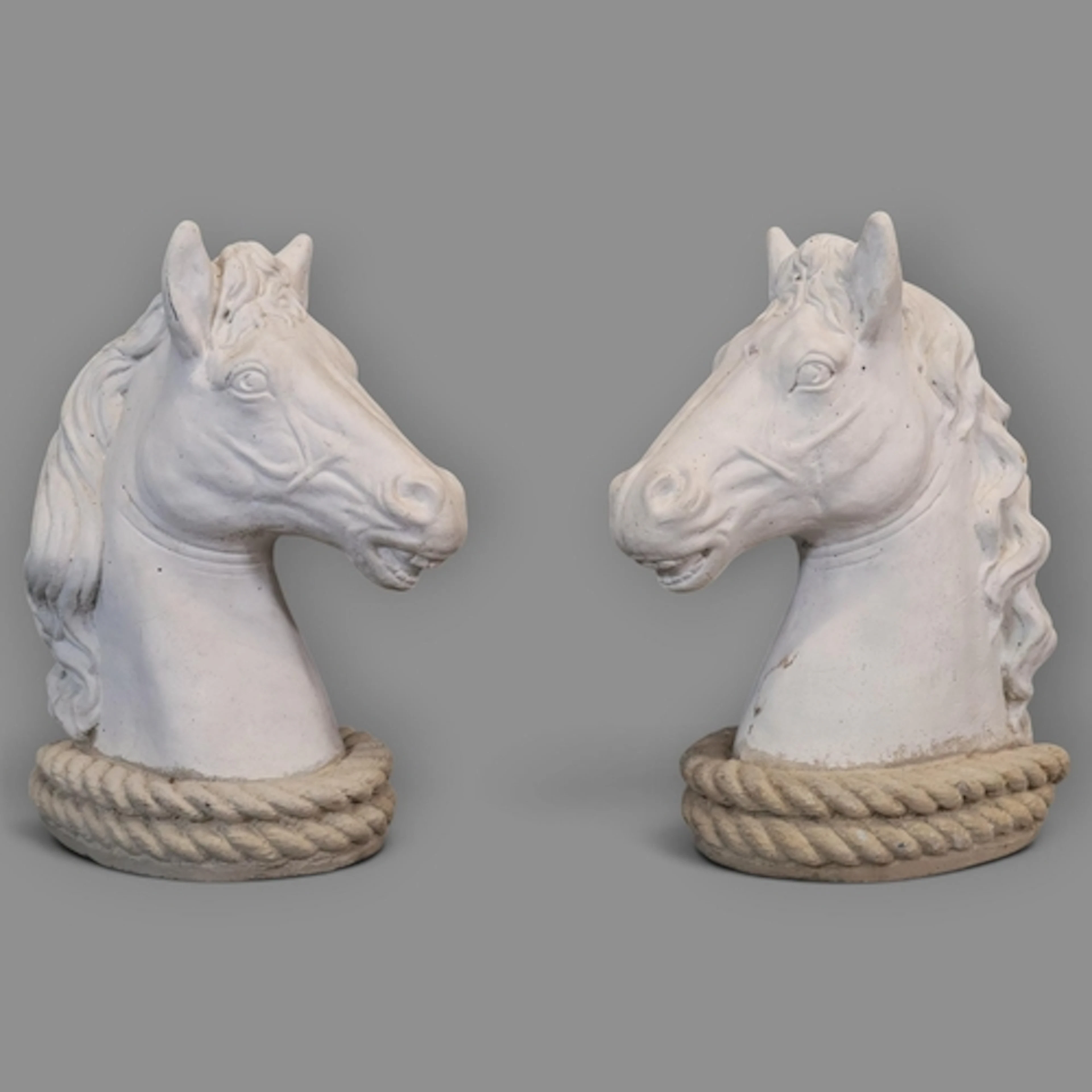 A pair of painted concrete gate post toppers / garden orname...