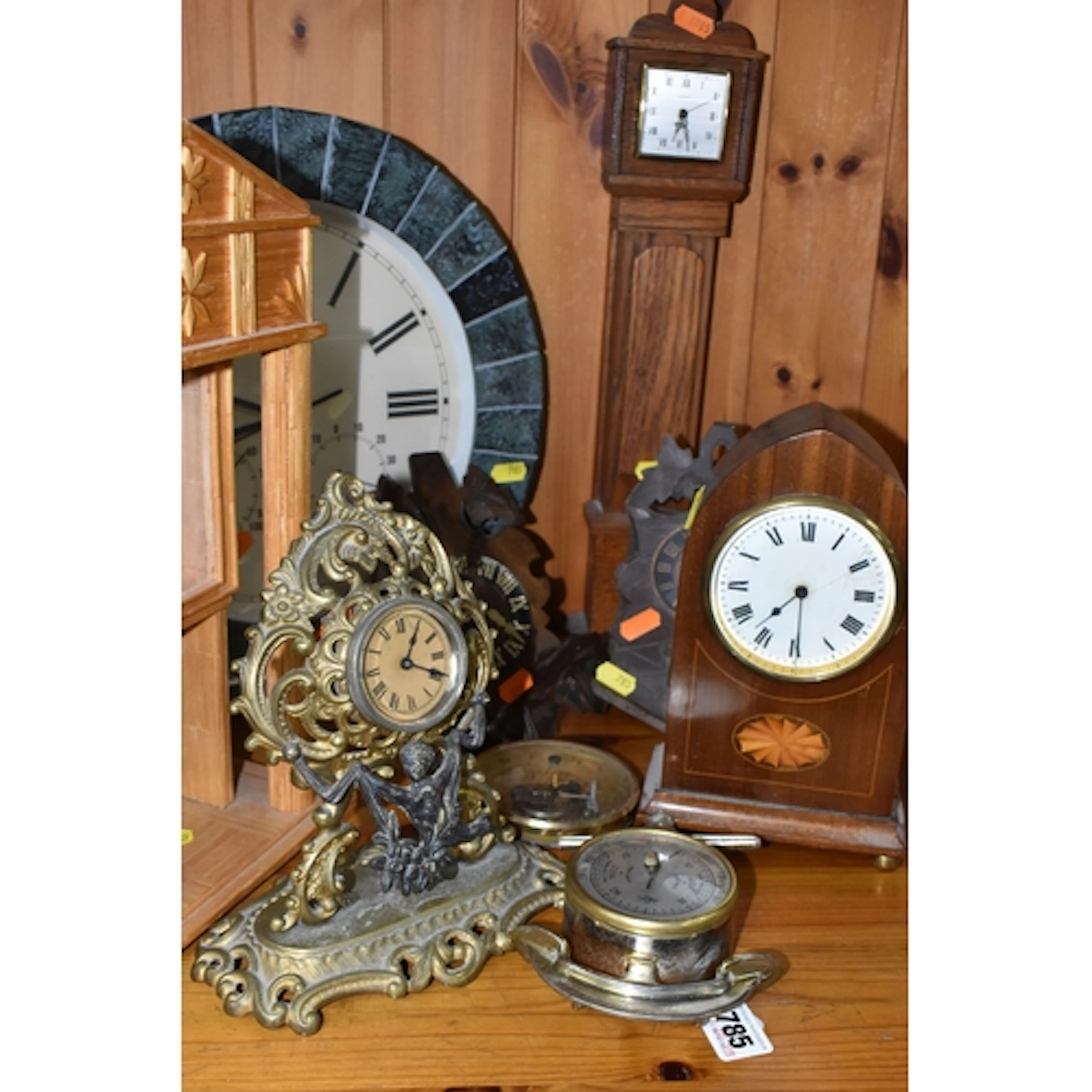 A GROUP OF CLOCKS, comprising two black forest style cuckoo ...