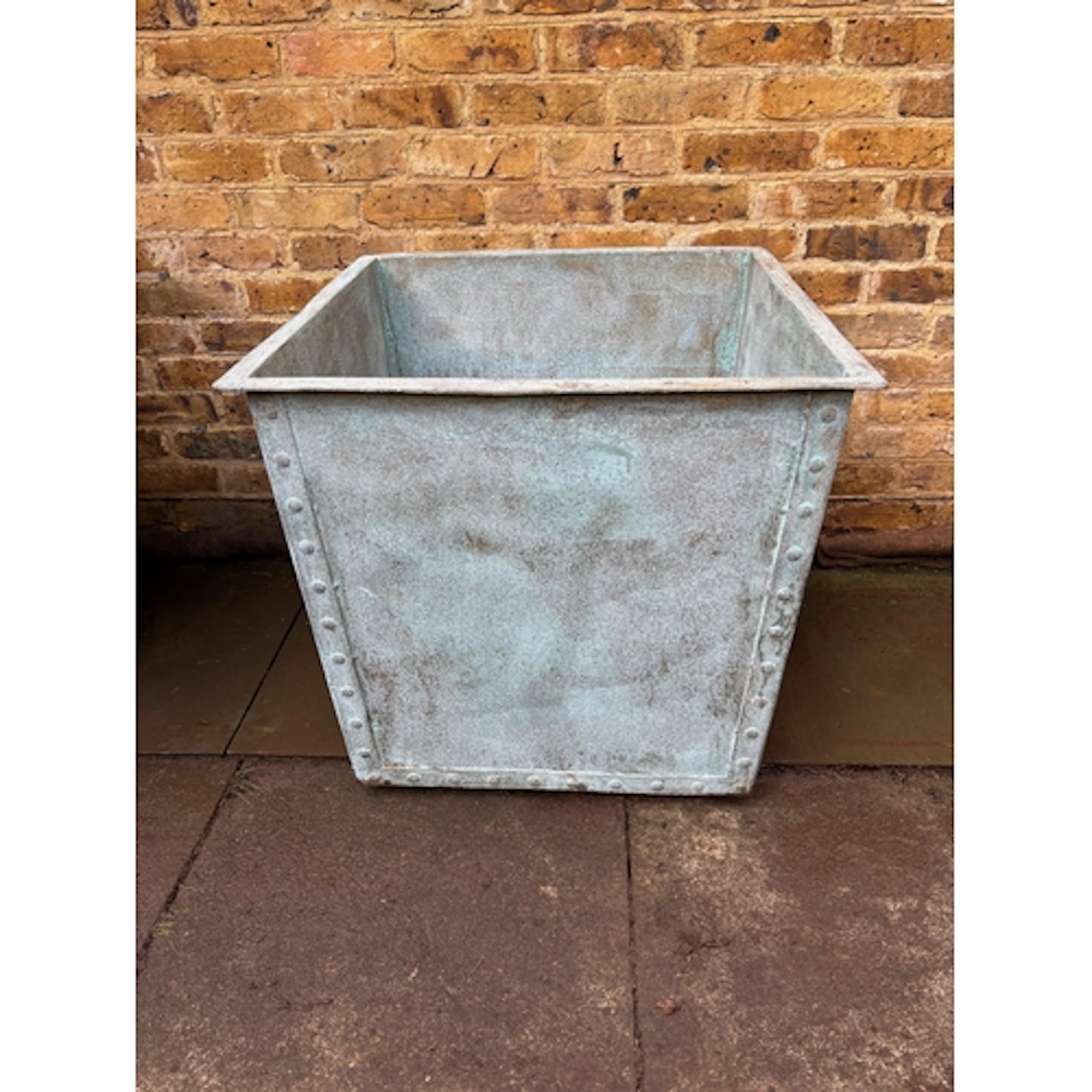A large heavy square riveted hot dipped galvanised tub, verd...