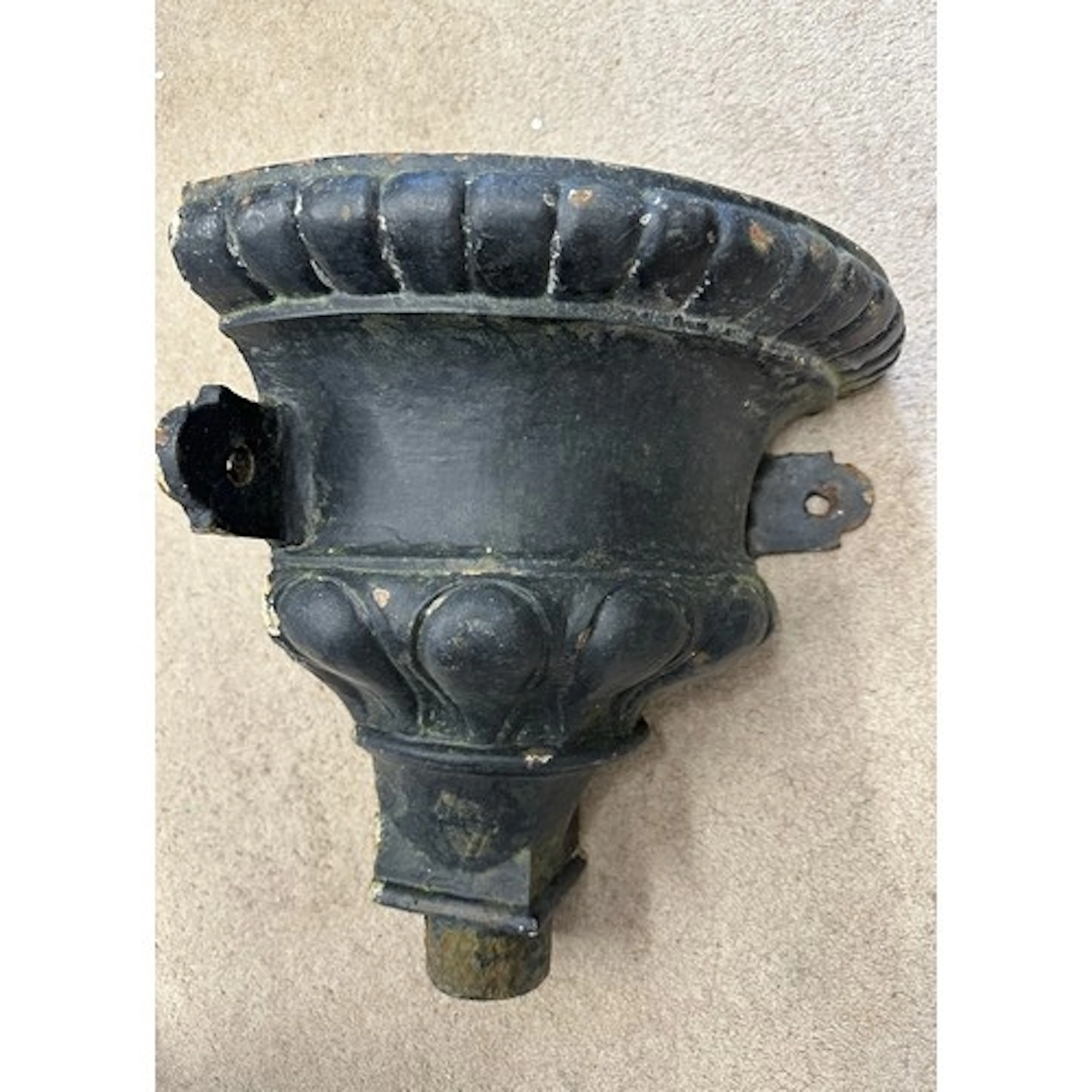 A cast iron hopper salvaged from the Methodist Church, Princ...