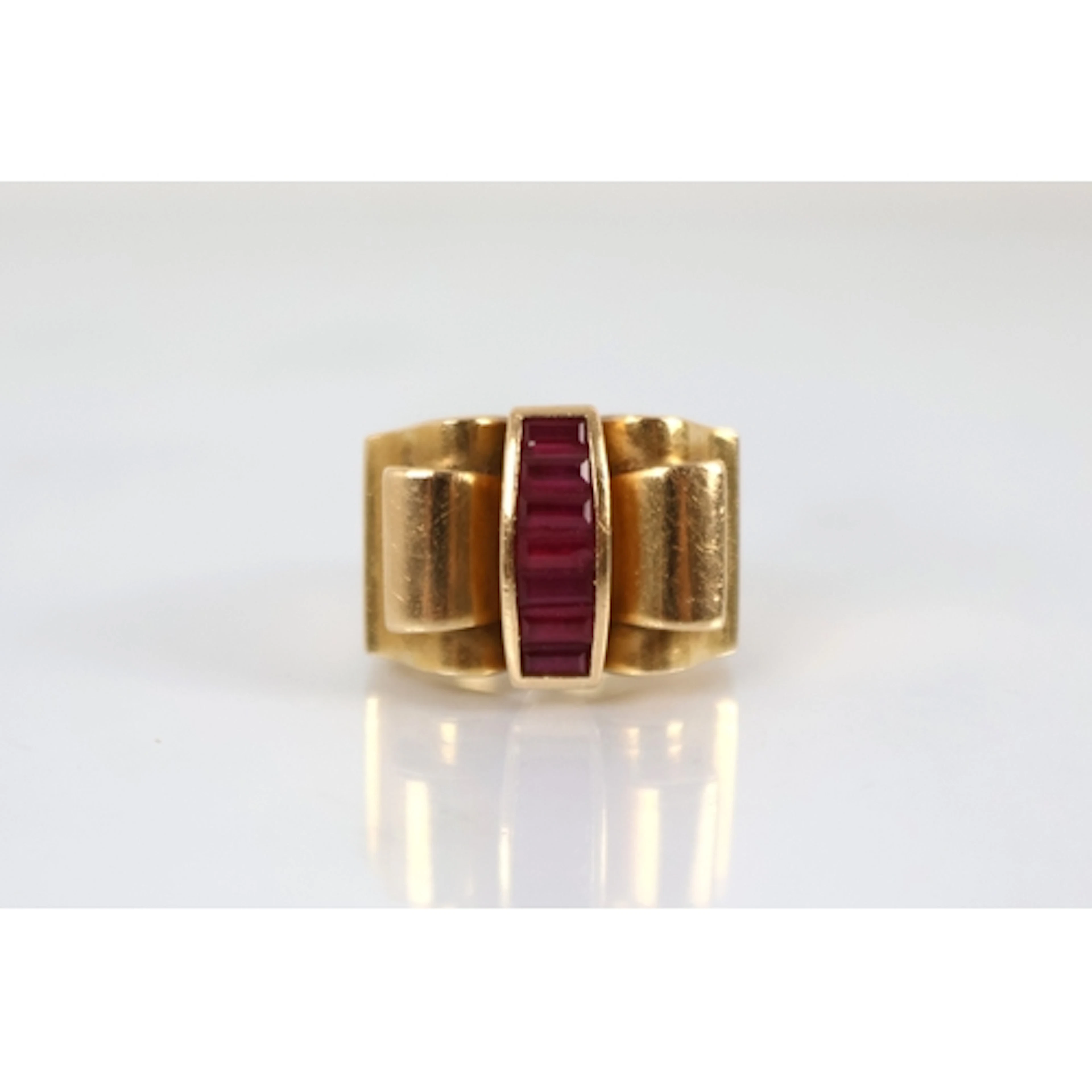 A French Art Deco ruby set cocktail ring, the Odeonesque des...