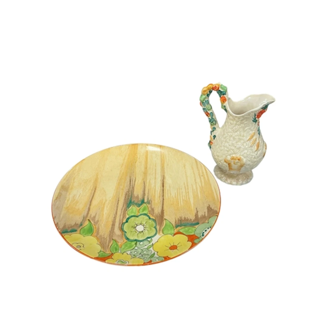 A Clarice Cliff Bizarre Jonquil wall plate, diameter 34cm an...