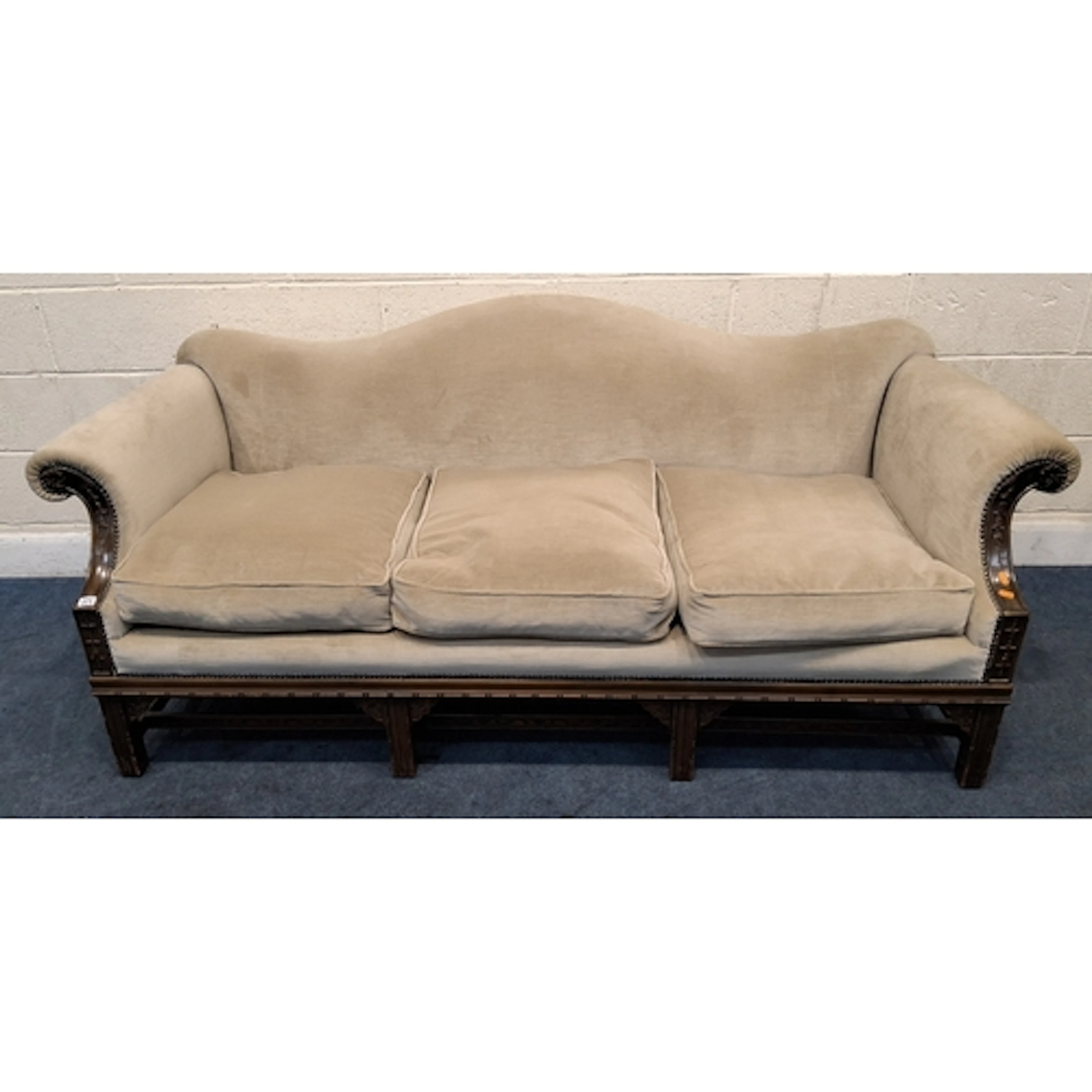 AN EARLY 20TH CENTURY CHIPPENDALE STYLE CAMEL BACK THREE SEA...