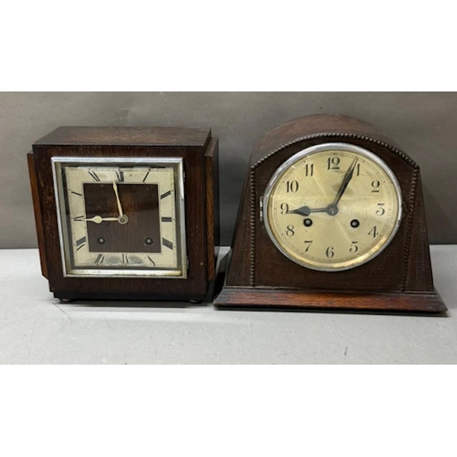 Two Art Deco mantel clocks, one square, the other domed....