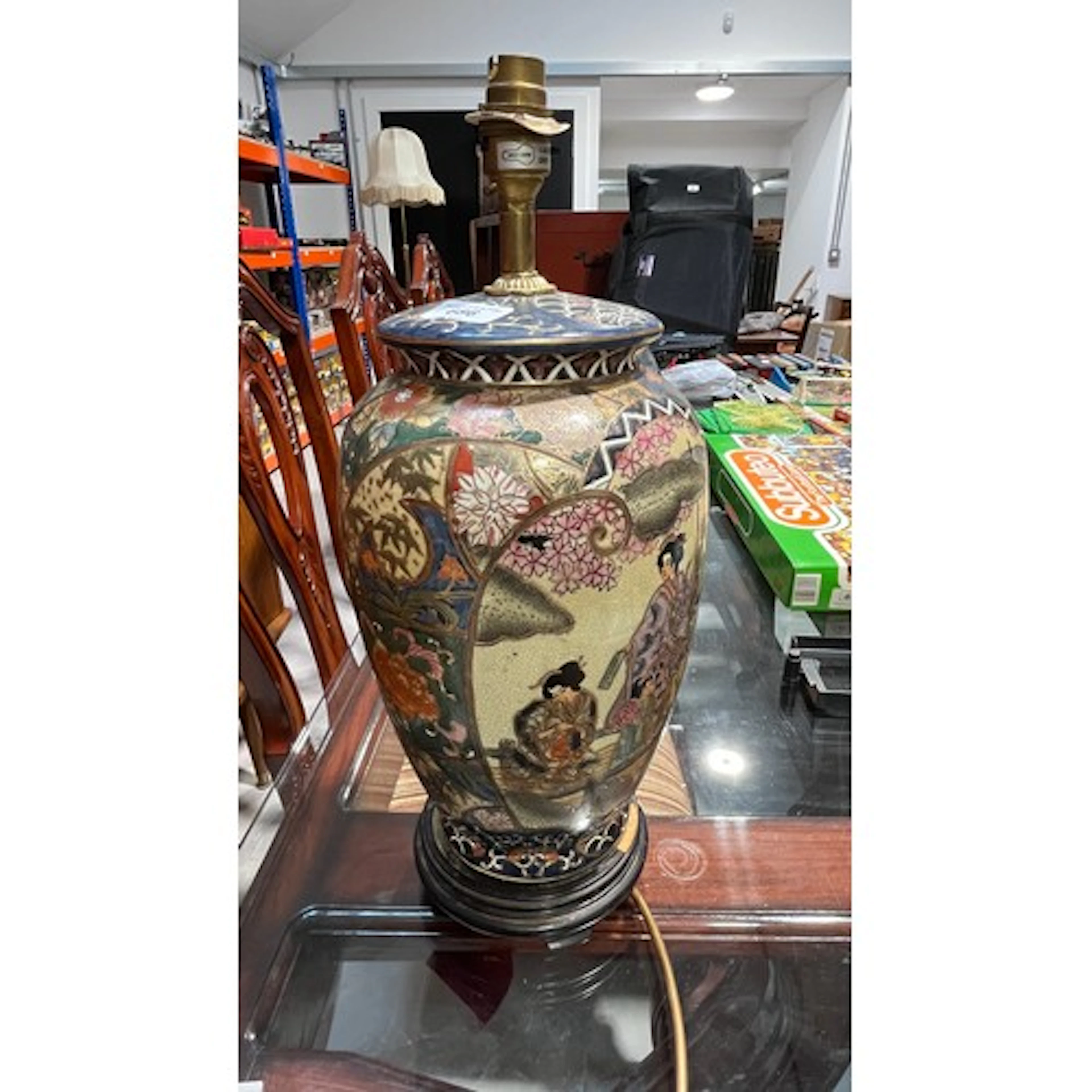 Chinese style table lamp decorated with traditional scenes.