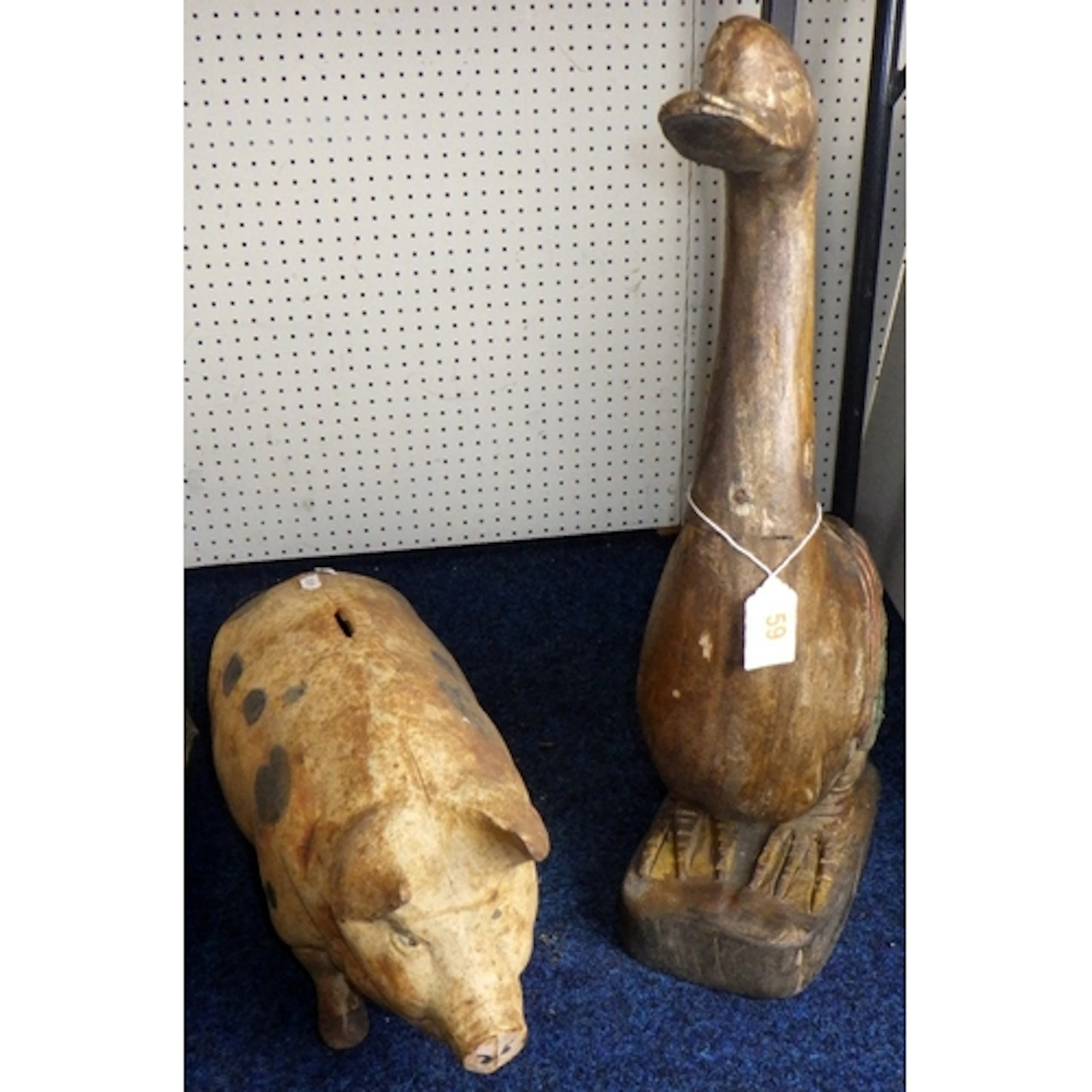 A large cast money pig together with a carved duck (2)