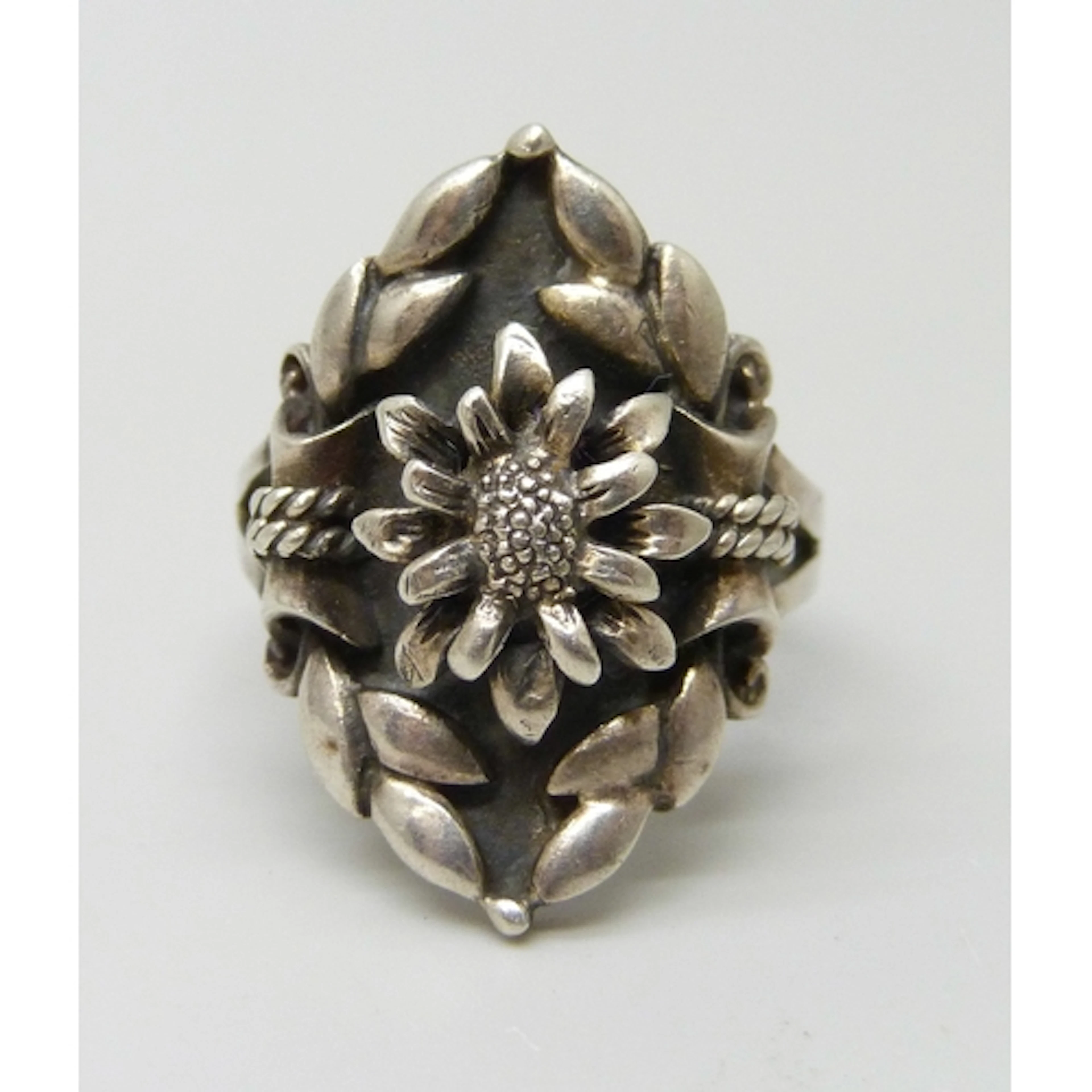 A Scandinavian style floral design silver ring with import m...