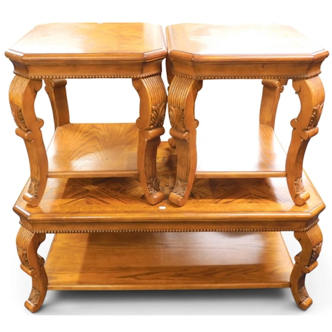A 20th century oak veneered two tier coffee table on reeded ...