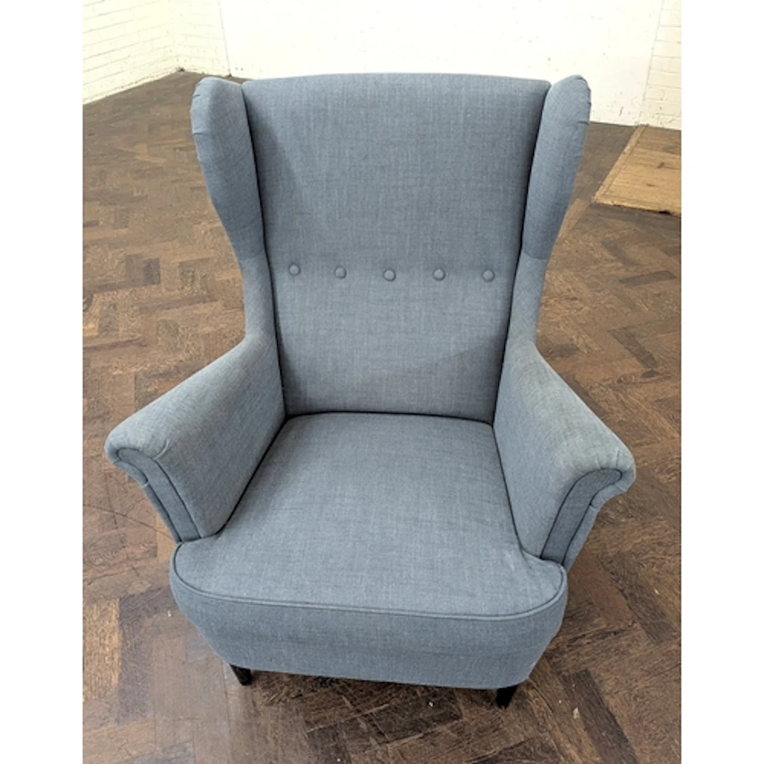 An Ikea modern grey upholstered wing back easy chair