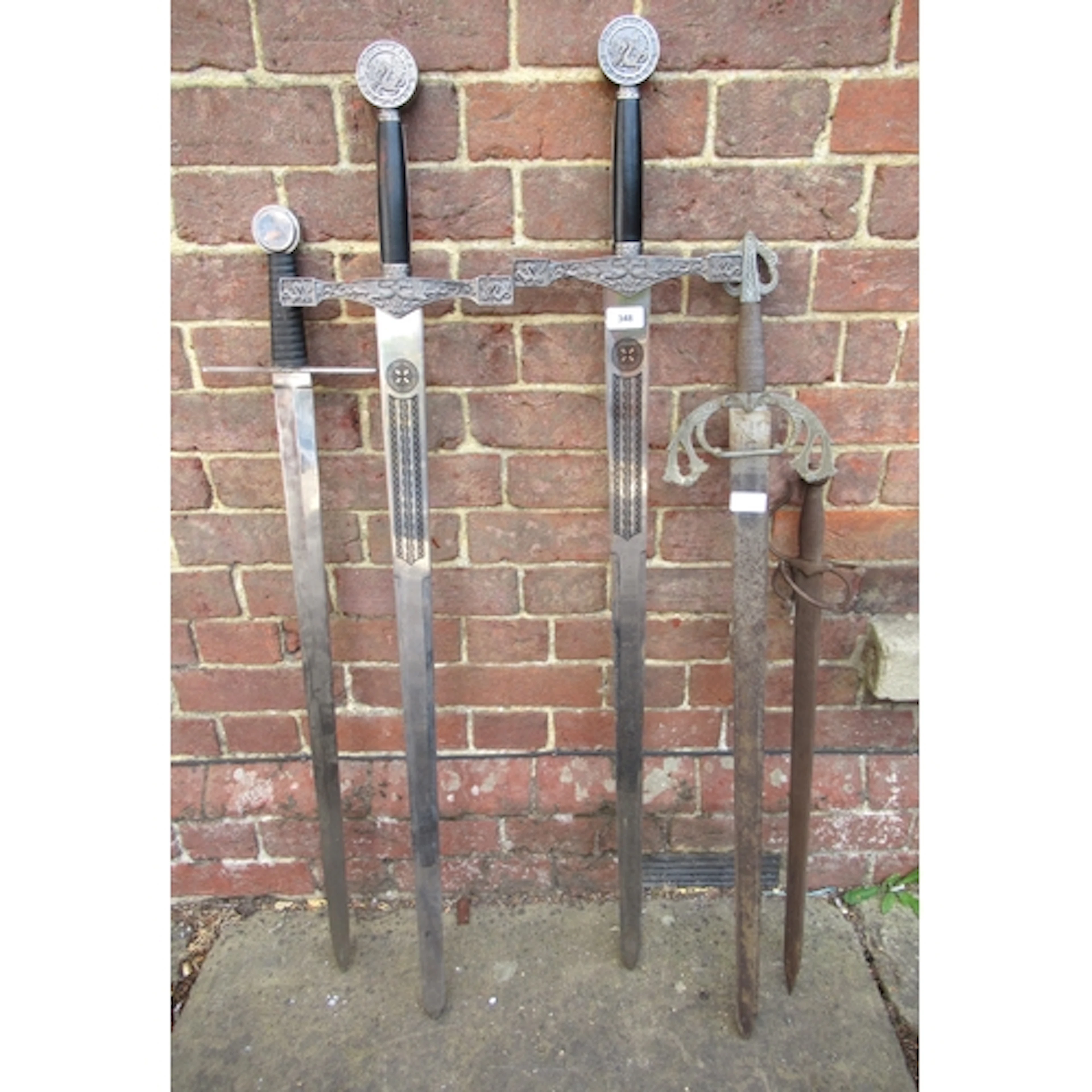 Group of five various reproduction swords in antique style