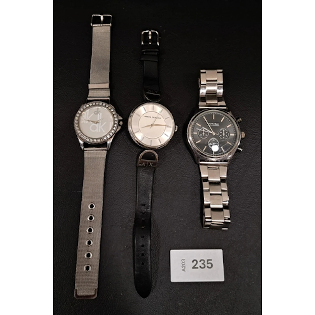 THREE FASHION WATCHES including Armani Exchange, none tickin...