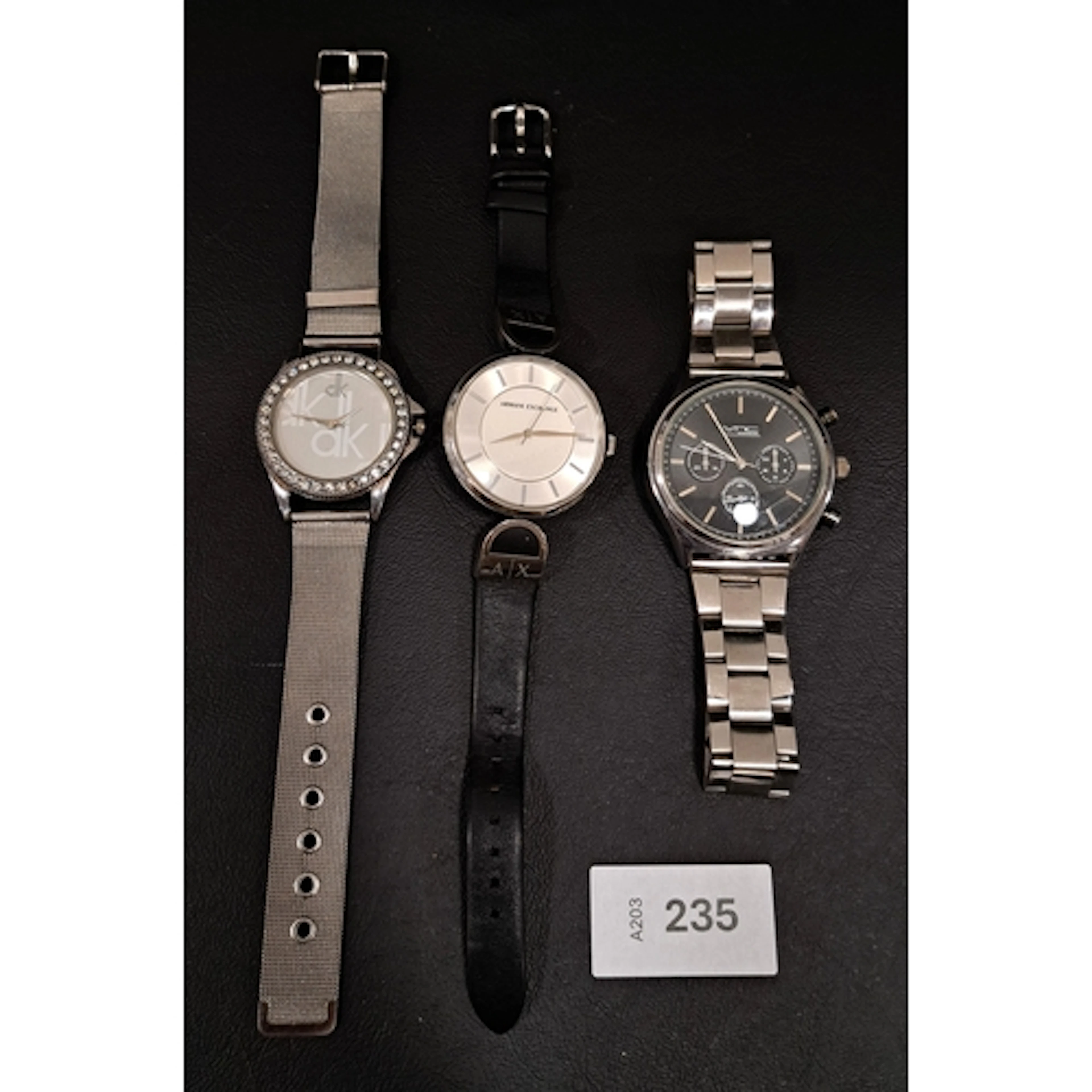 THREE FASHION WATCHES including Armani Exchange, none tickin...