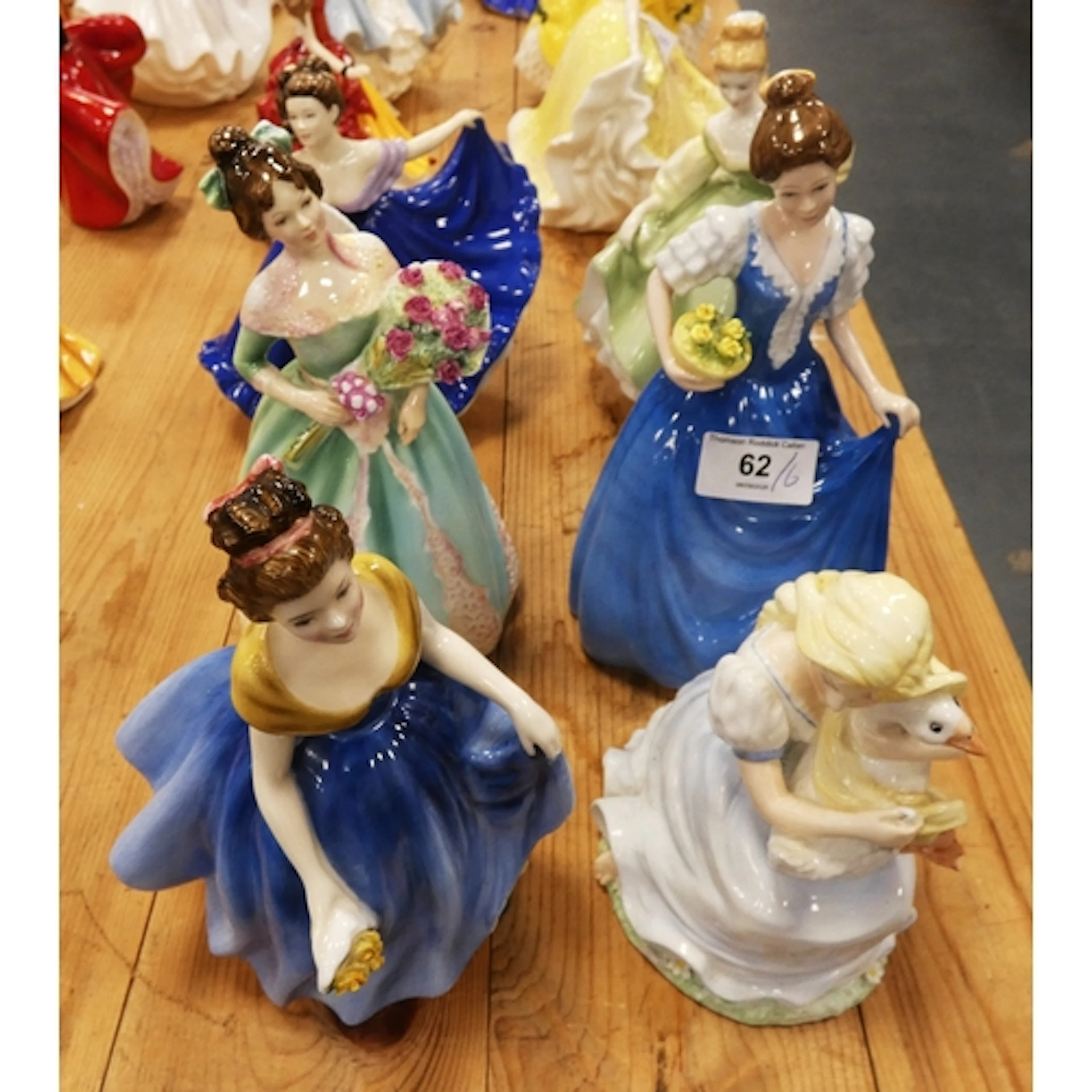 Six Royal Doulton and Coalport figurines to include Melanie,...