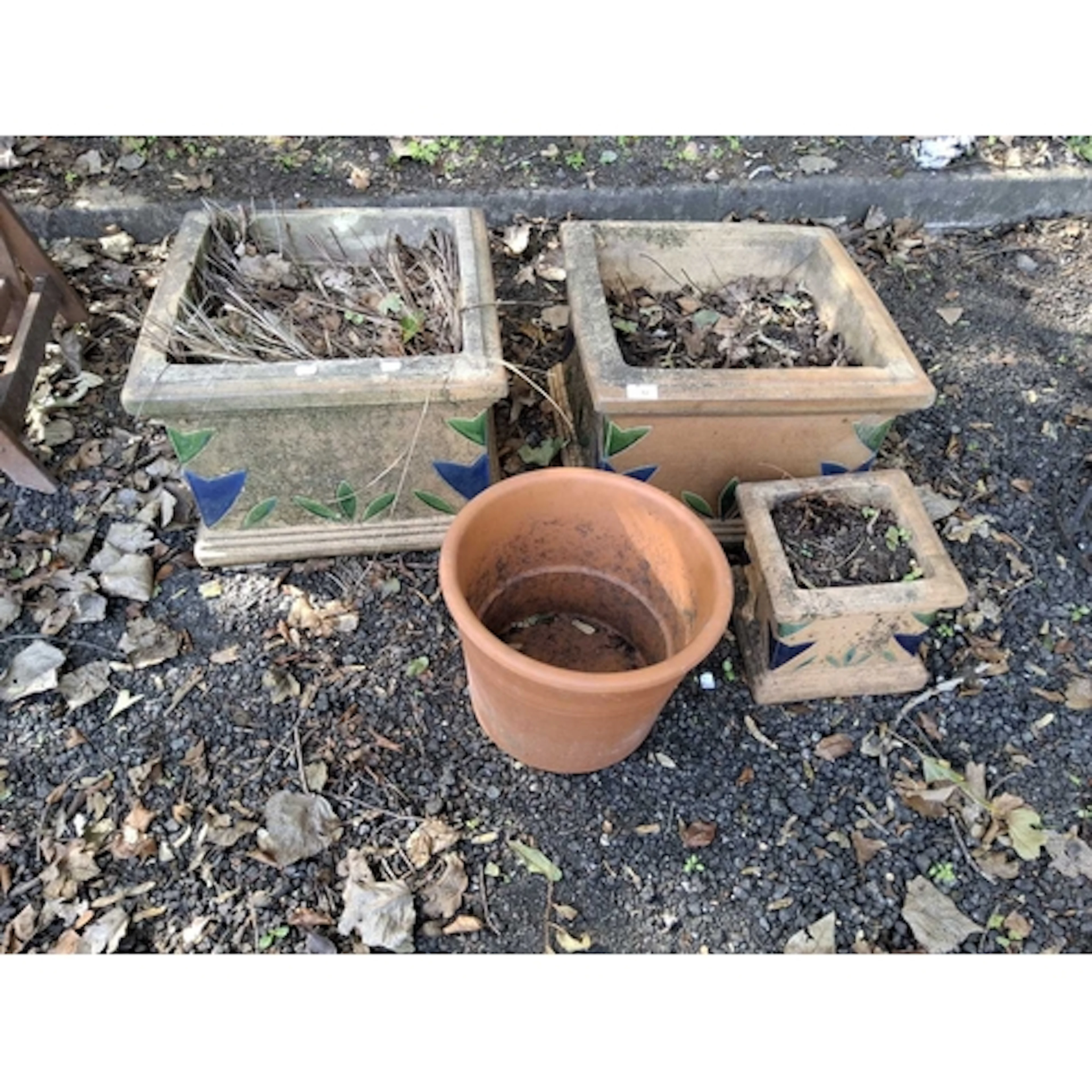 THREE SQUARE CONCRETE GARDEN PLANTERS AND A TERRACOTTS POT t...