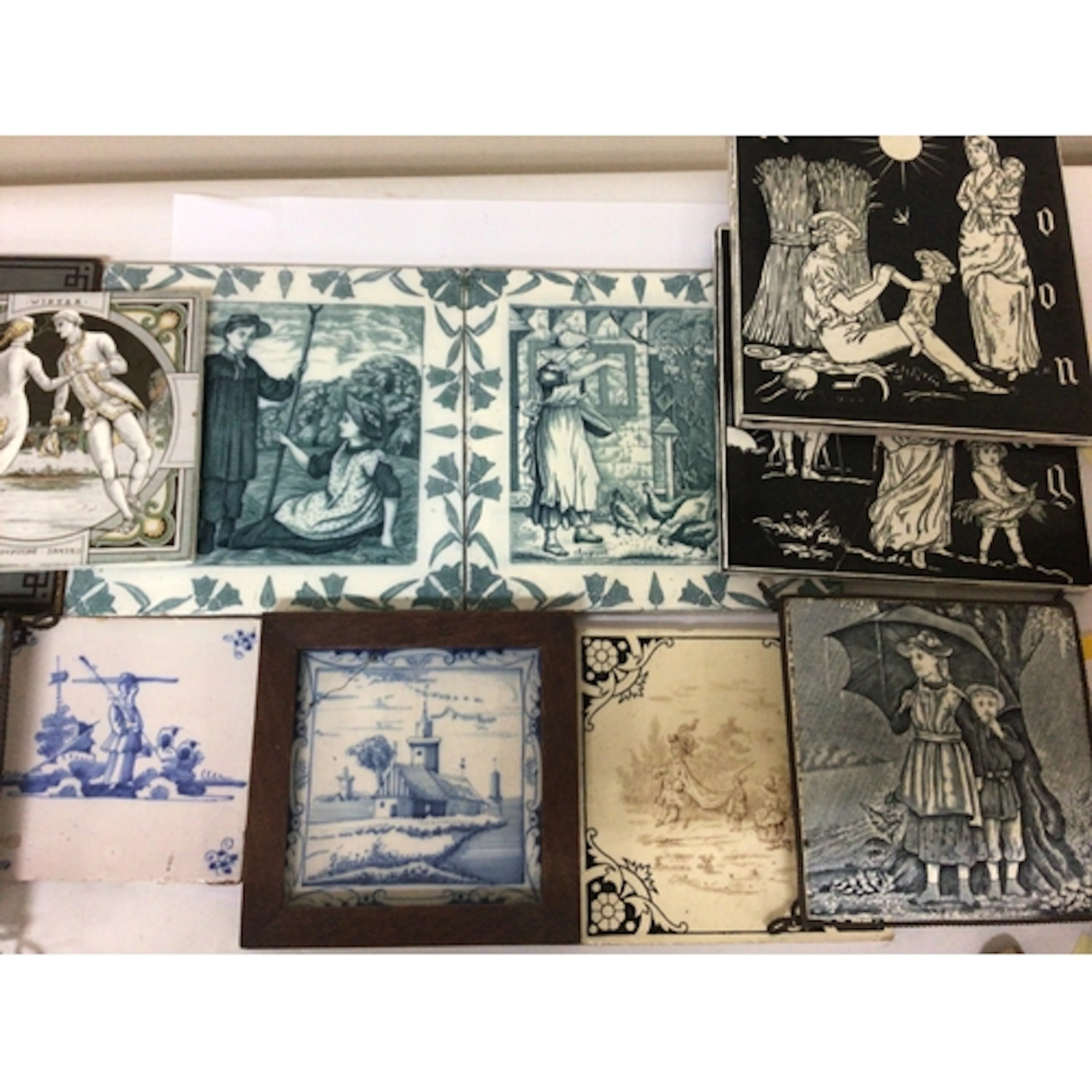 A collection of Victorian ceramic tiles including some...