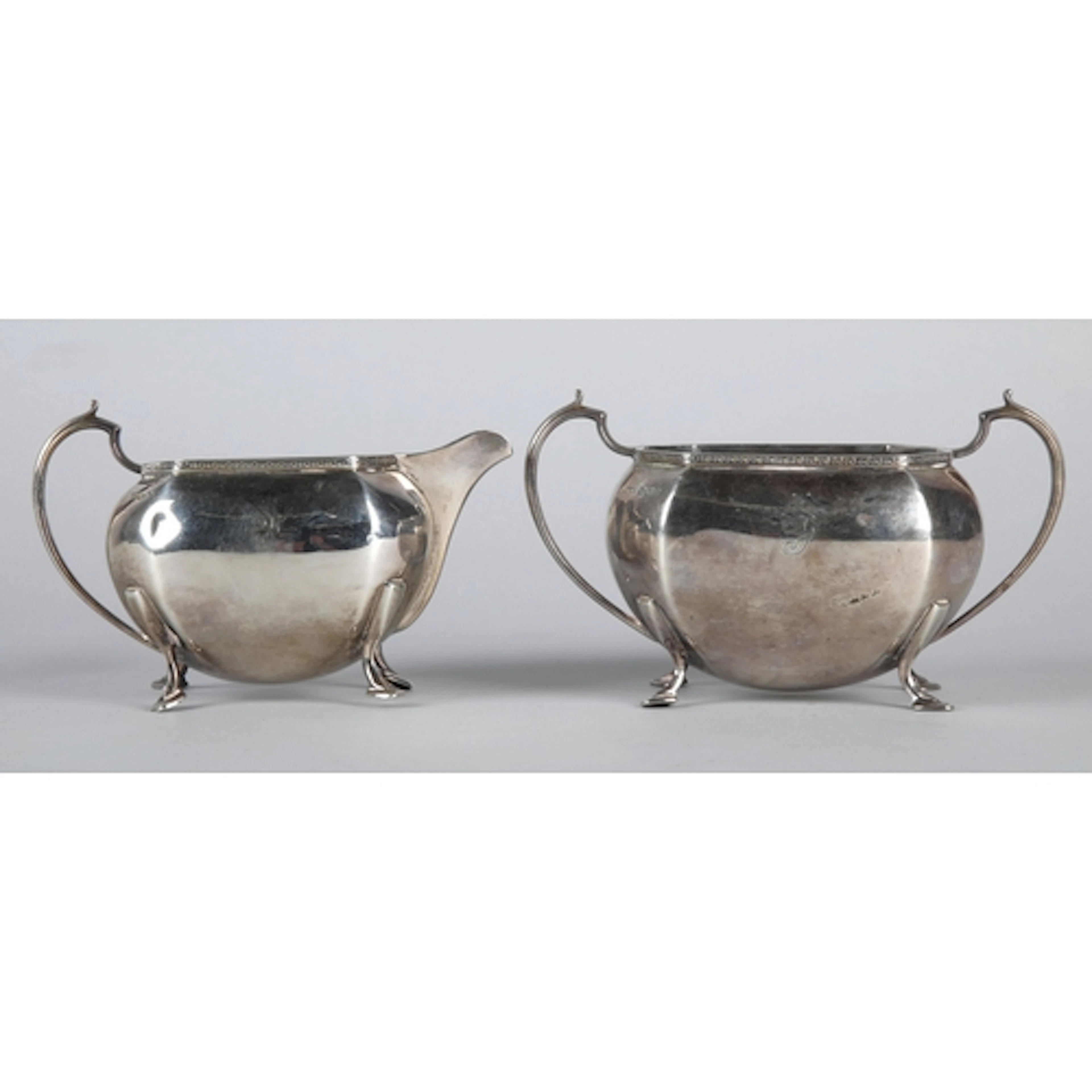 George V silver sugar bowl and matching cream jug with ring ...