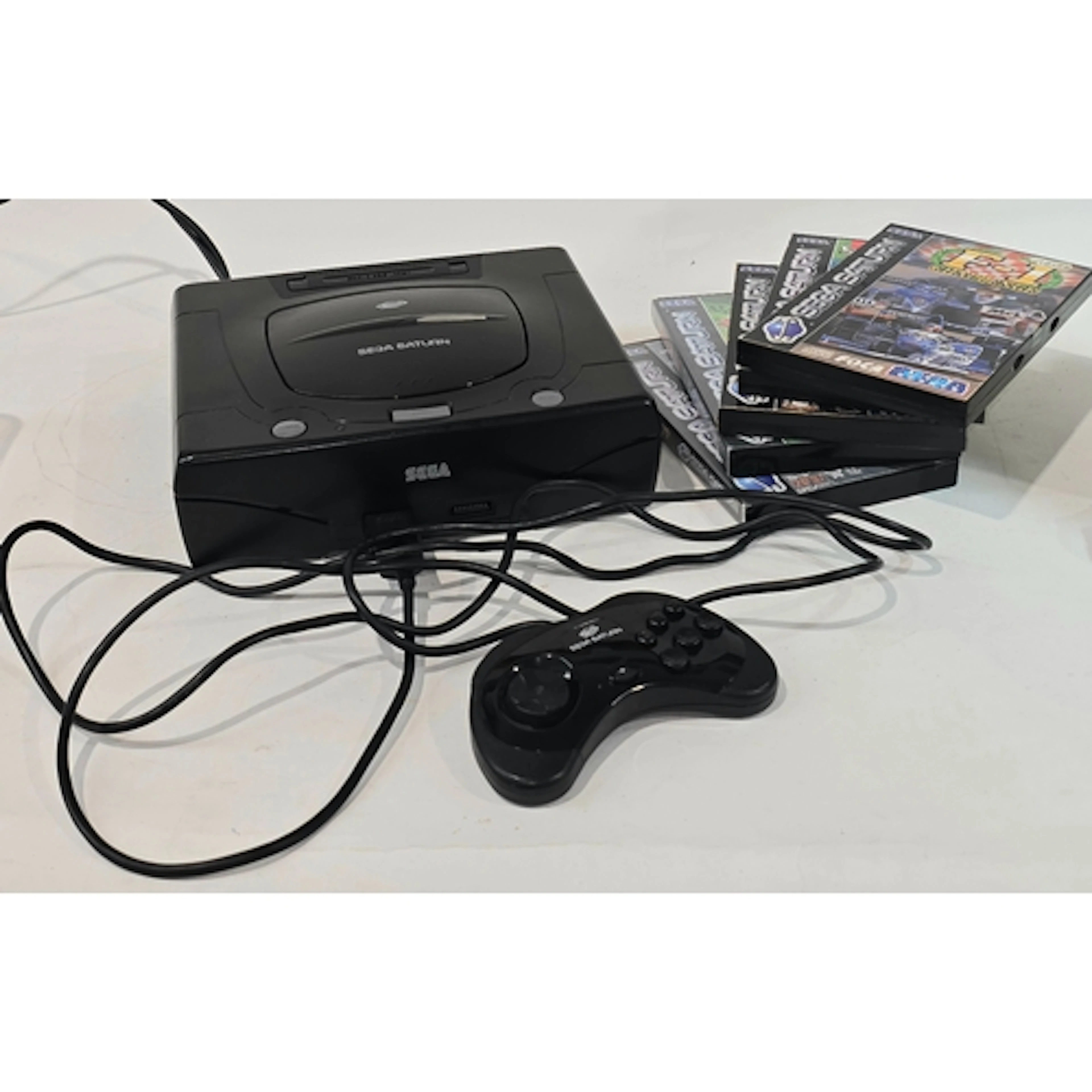 A vintage Sega Saturn games console complete with leads, con...