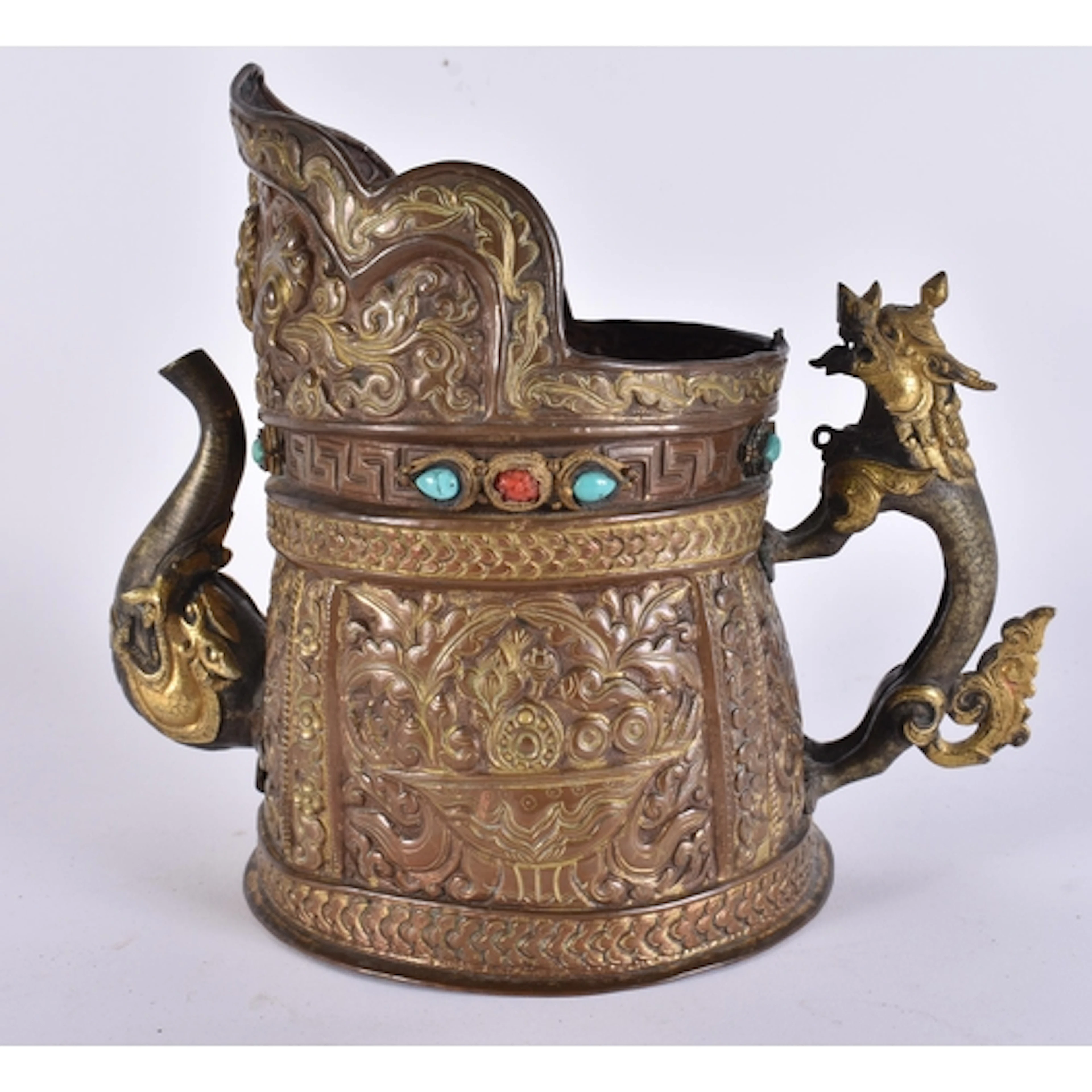 A 17TH/18TH CENTURY TIBETAN MONK'S CAP EWER inset with coral...