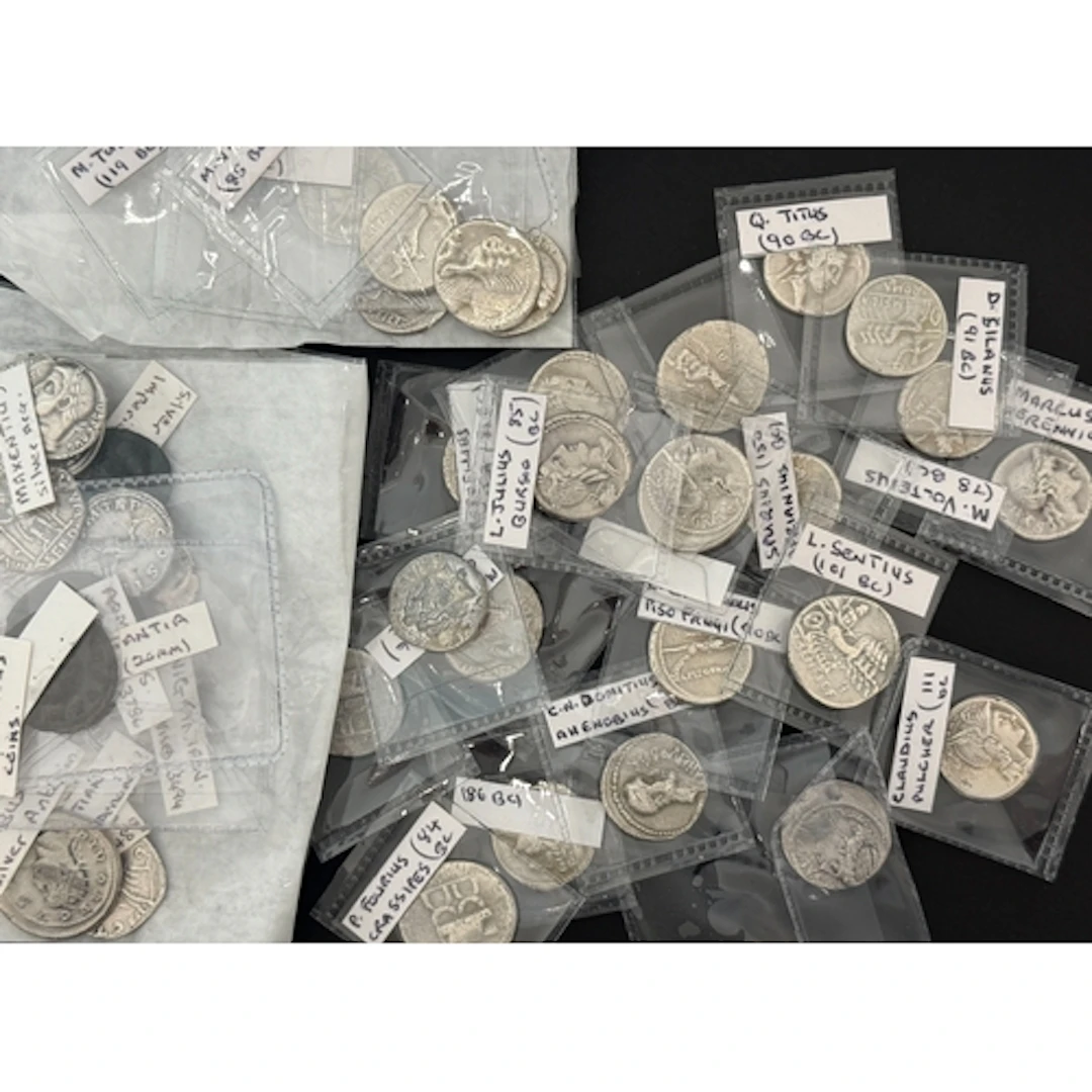 A group of forty-seven silver and bronze reproduction coins,...