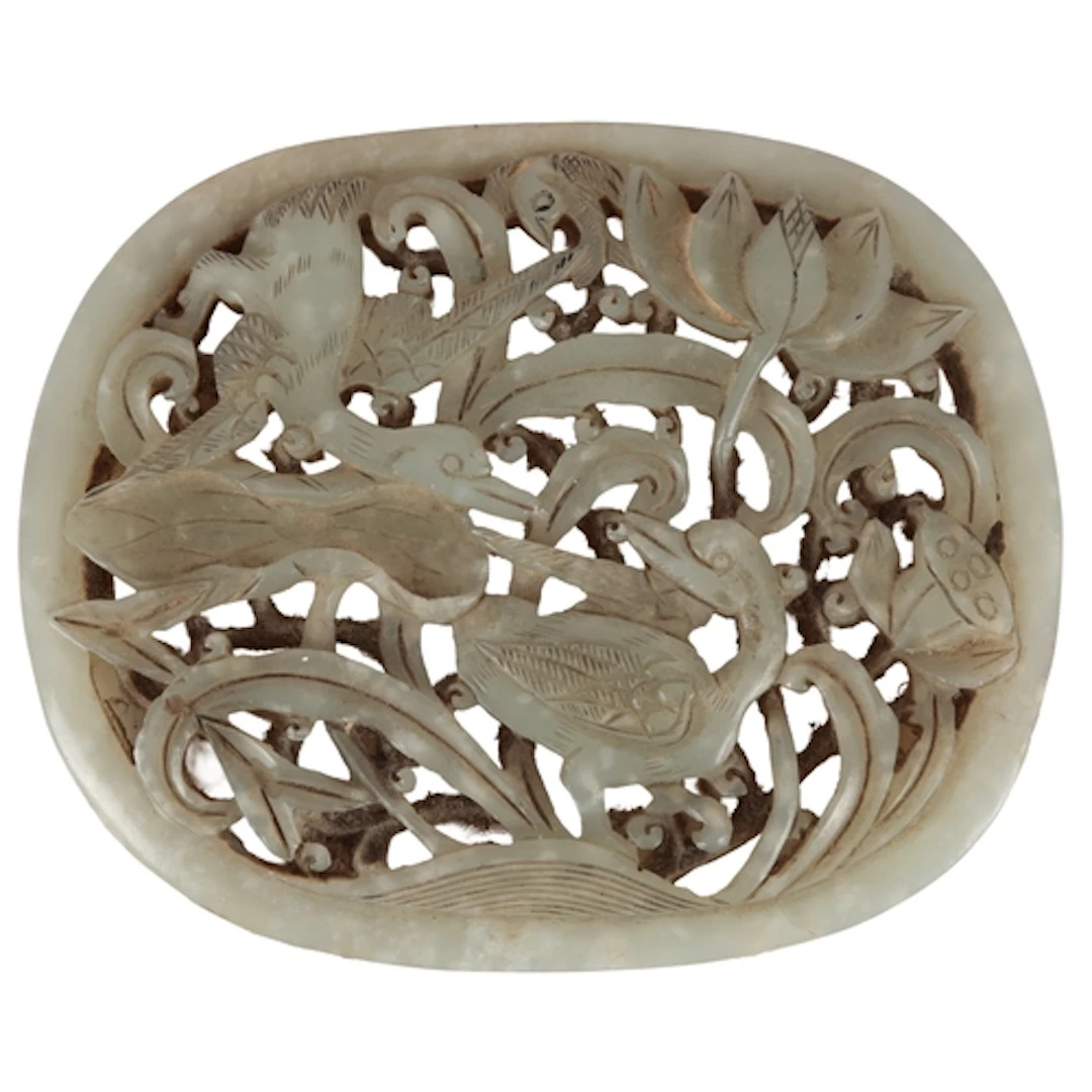 A Chinese pale celadon jade 'geese and lotus' plaque, Ming d...