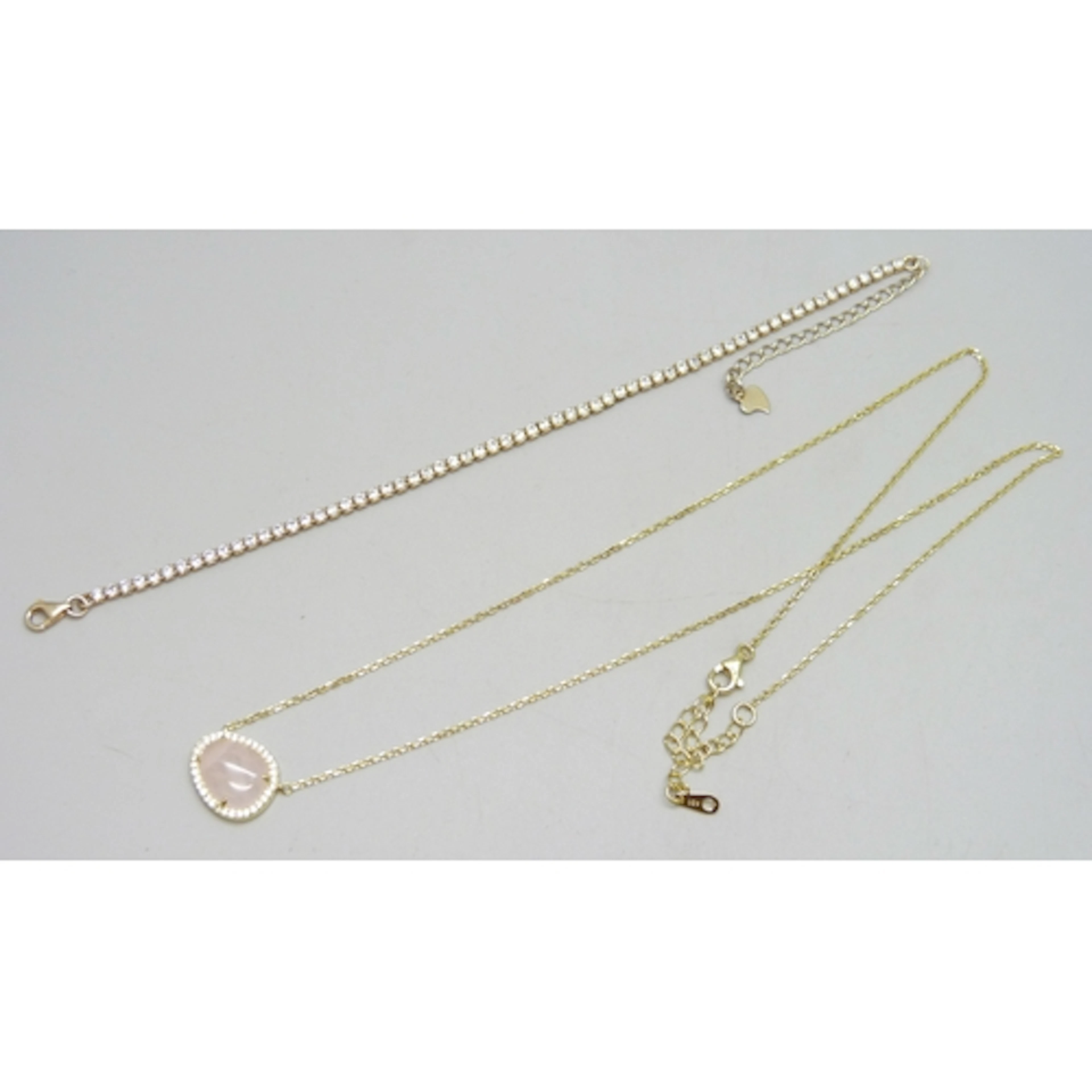 A silver gilt white stone set tennis bracelet, 21.5cm, and a...