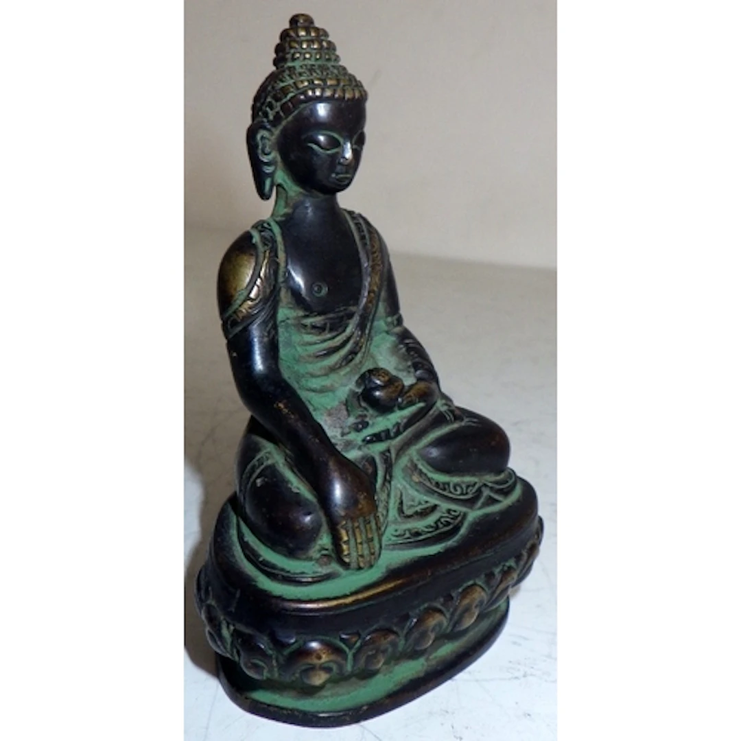 A small bronze Buddha, 9cm tall