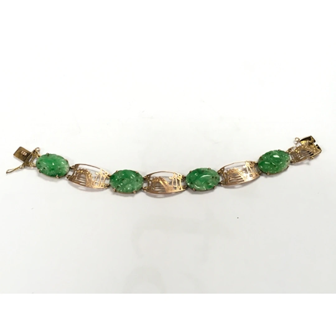 A 9ct Gold jade bracelet, 11.5g total weight. 17cm long ...