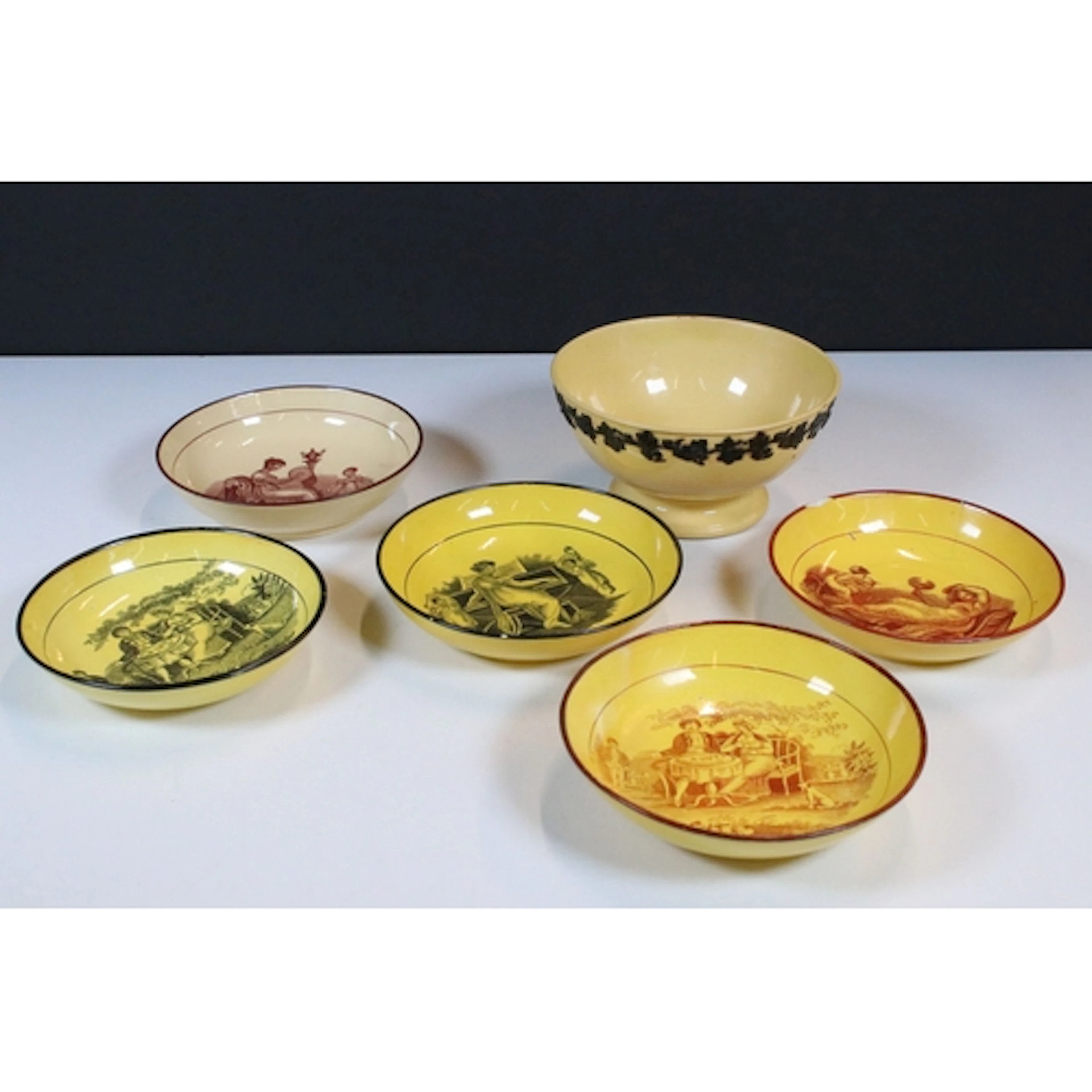 Collection of five mainly early 19th century pottery saucers...